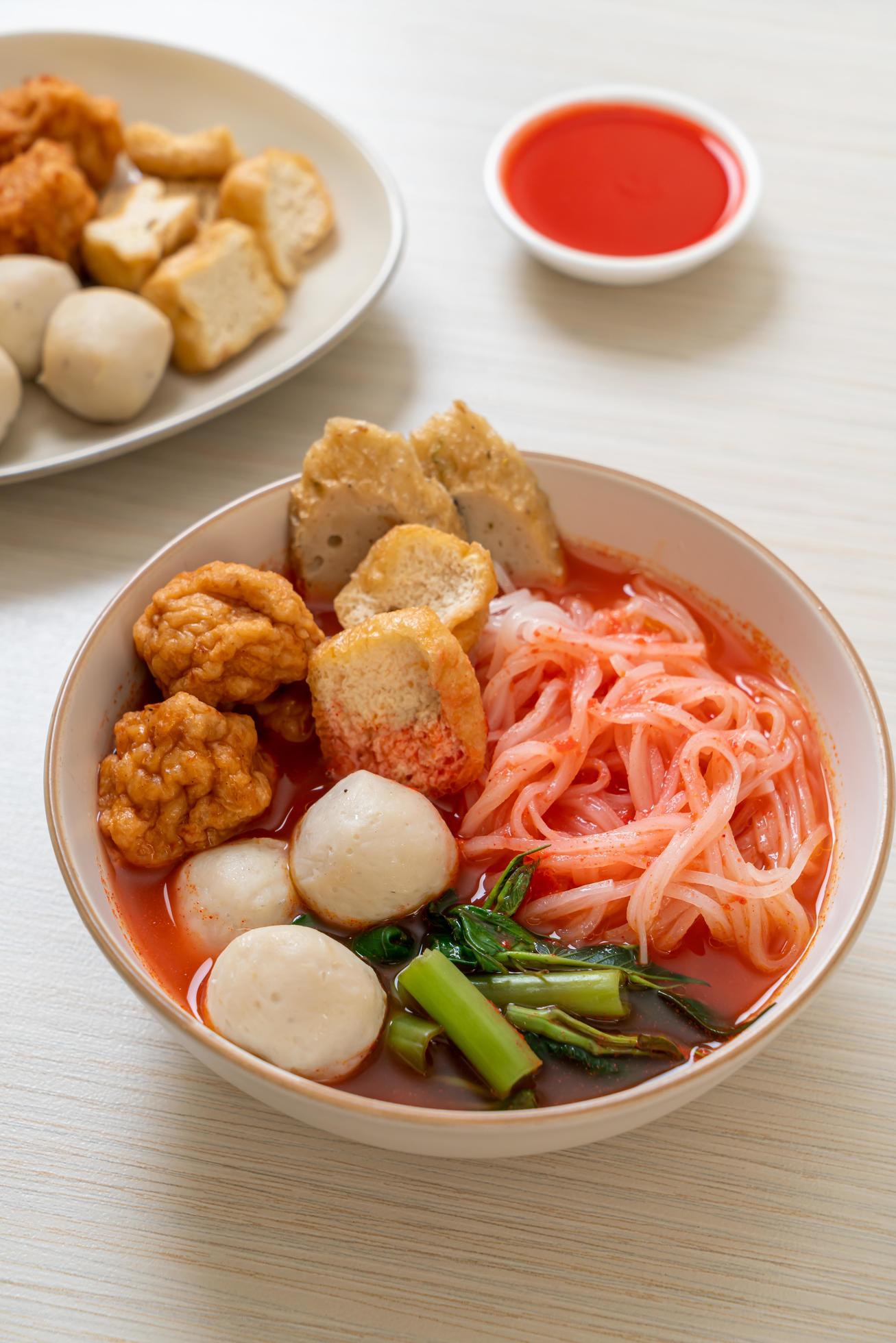 Small flat rice noodles with fish balls and shrimp balls in pink soup, Yen Ta Four or Yen Ta Fo – Asian food style Stock Free