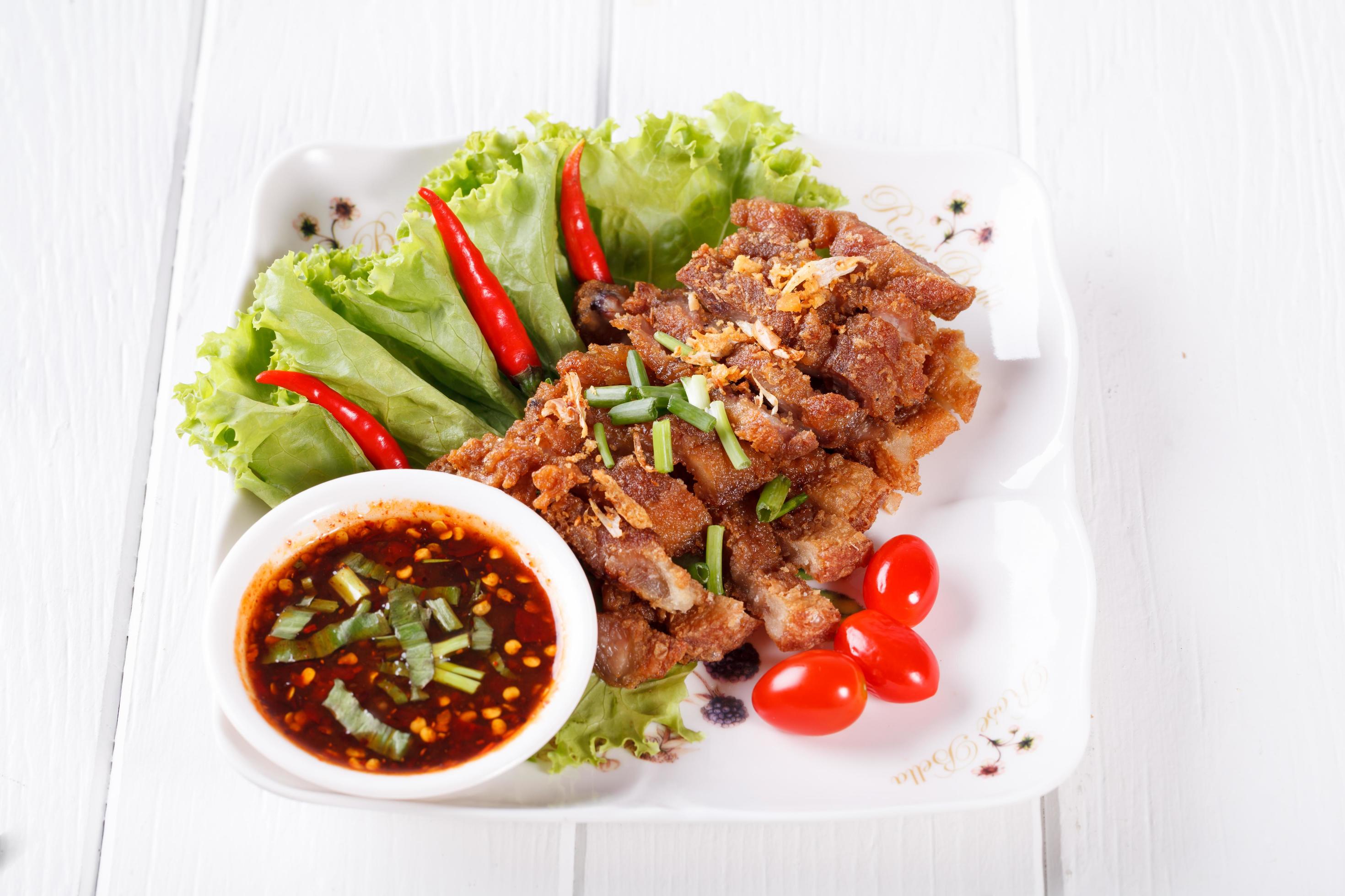 streaky pork fried with spicy dipping sauce, Thai food Stock Free