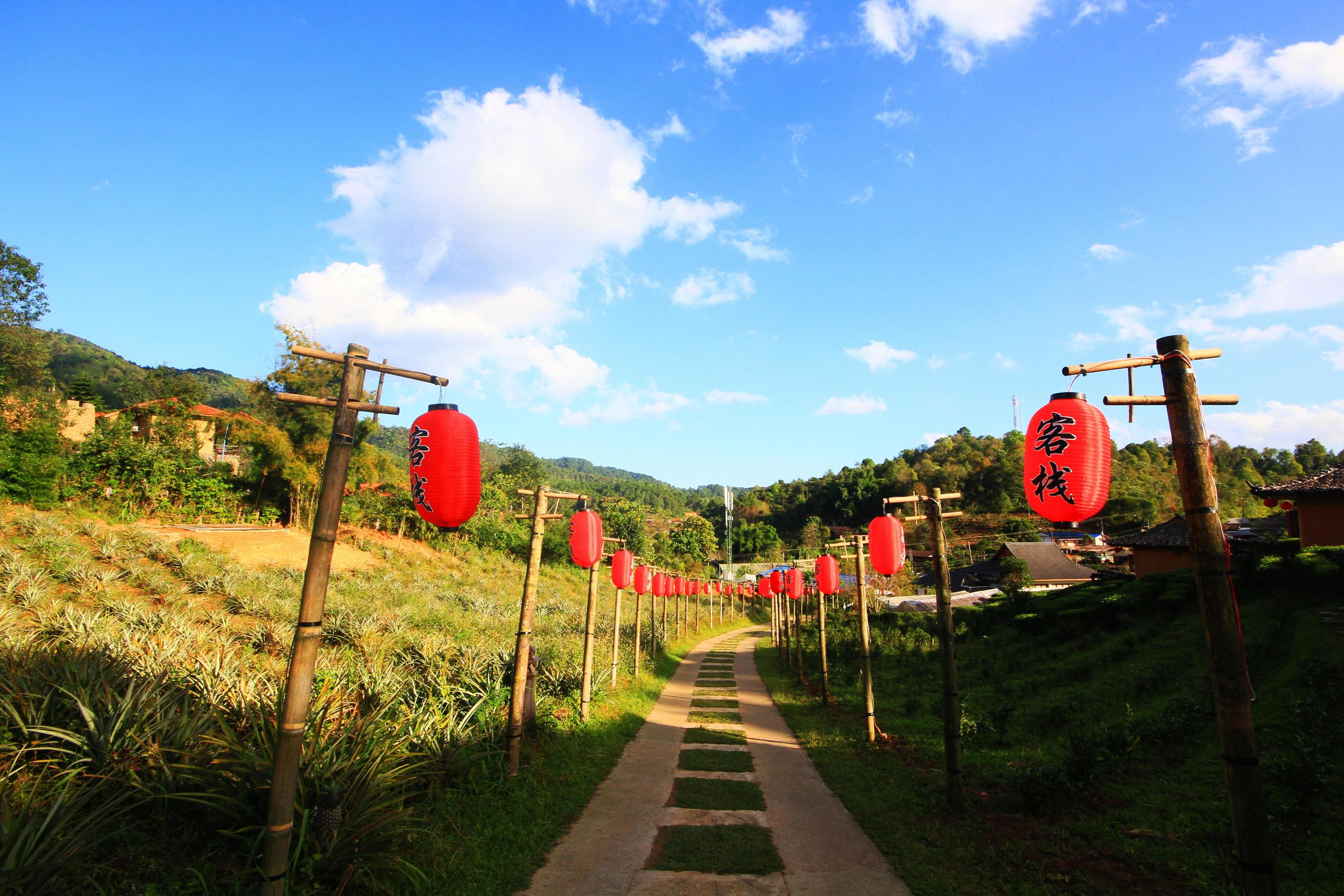 Beautiful red paper Chinese lanterns decoration on walkway of Lee Wine Ruk Thai Resort located on the mountain, Thailand Stock Free