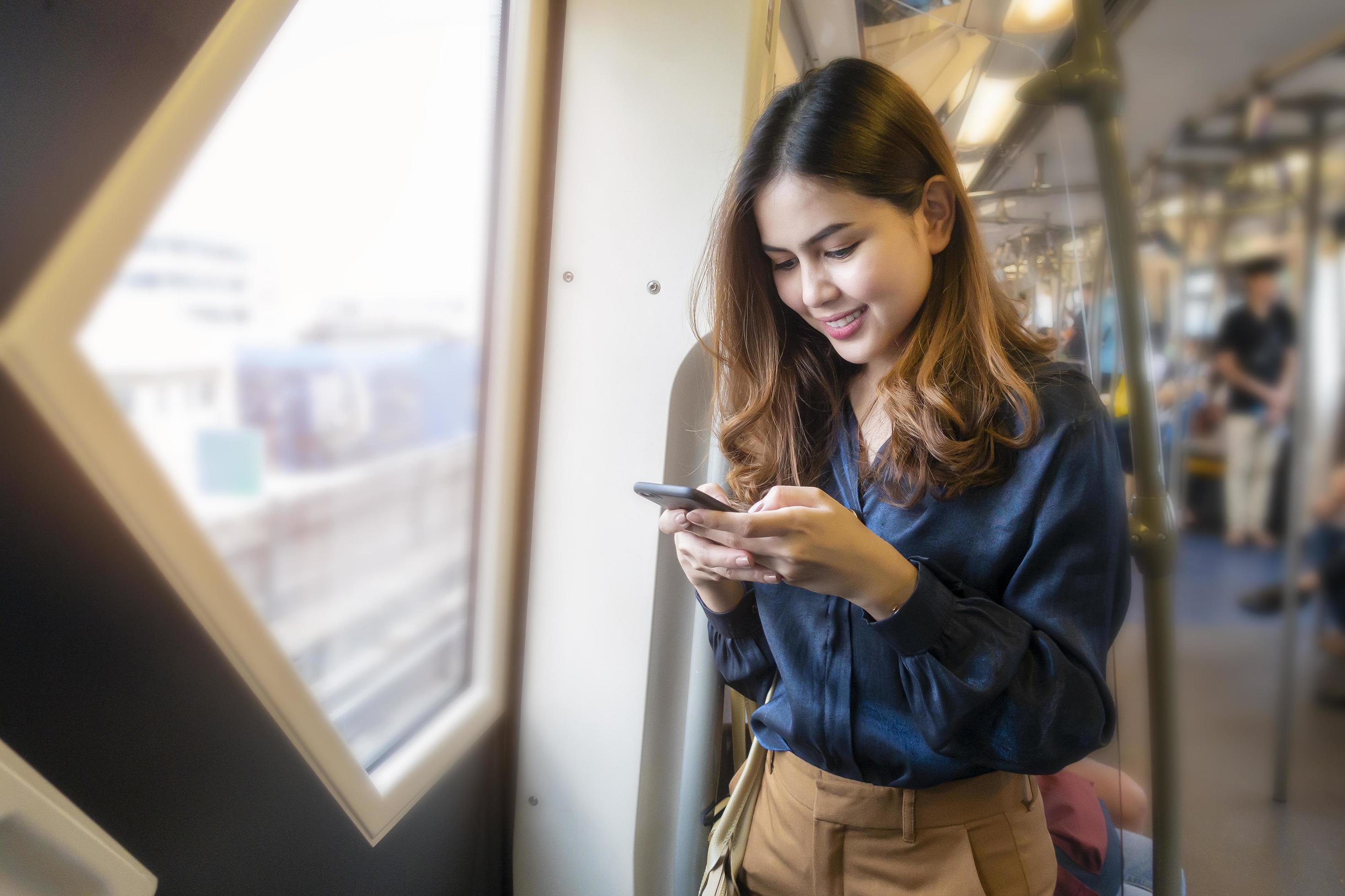 Beautiful business woman in metro train in city Stock Free