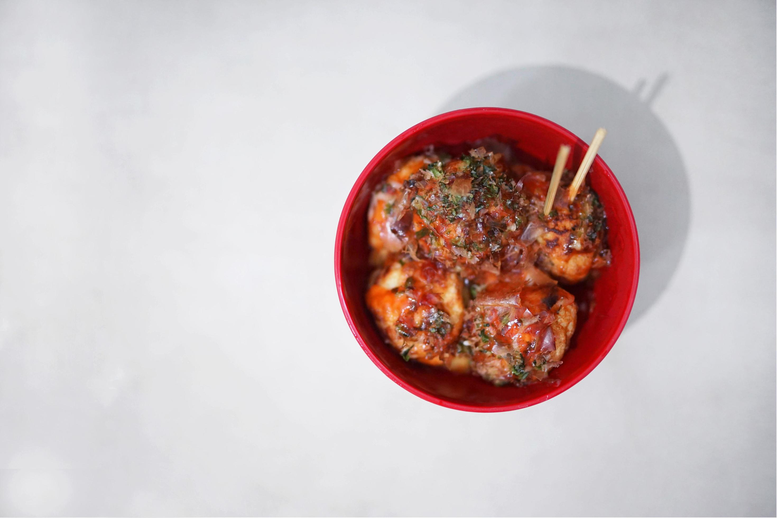 traditional Japanese food, takoyaki with sauce on a cutting board Stock Free