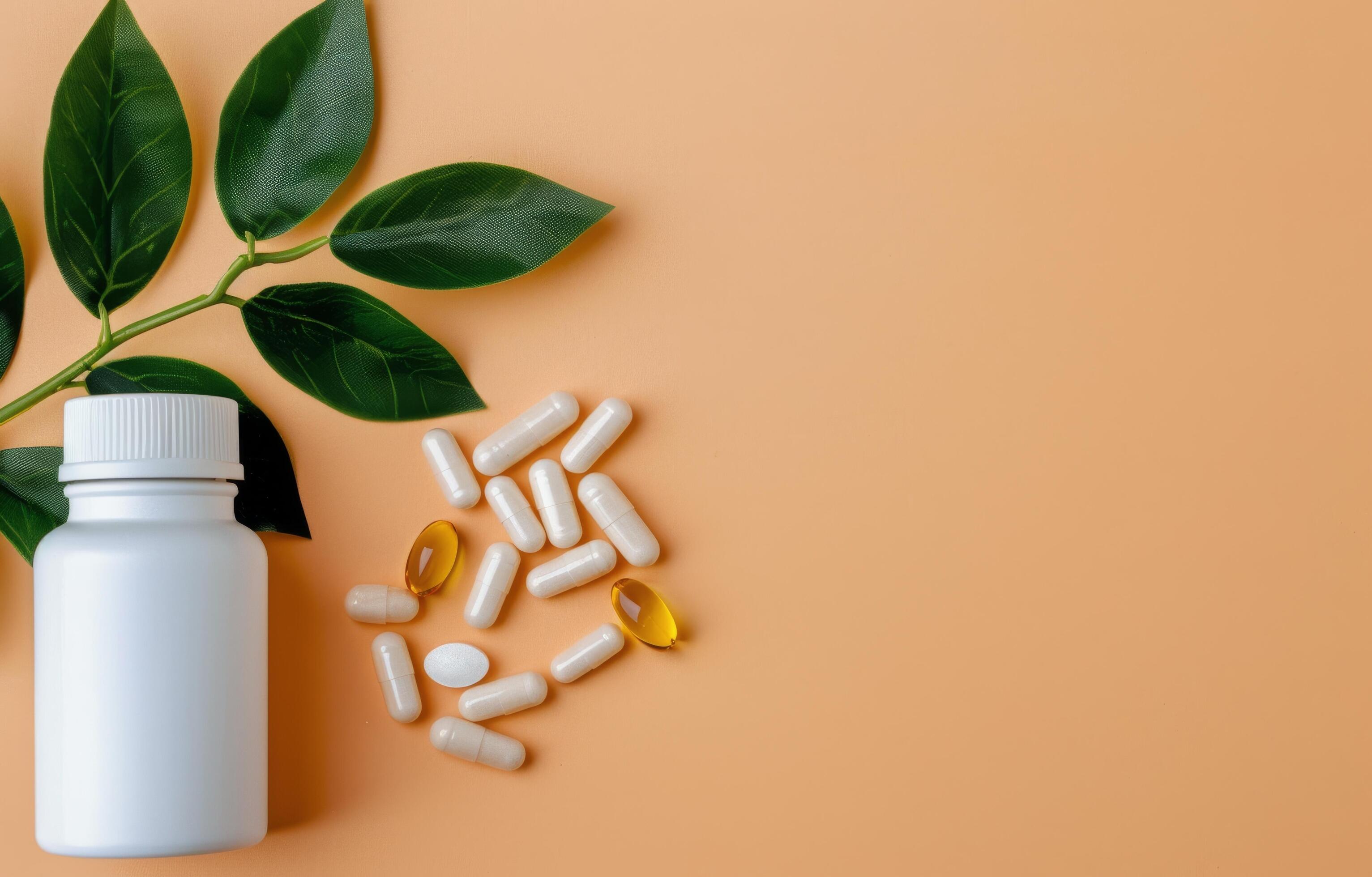 Pills and Leaves on a Peach Background Stock Free