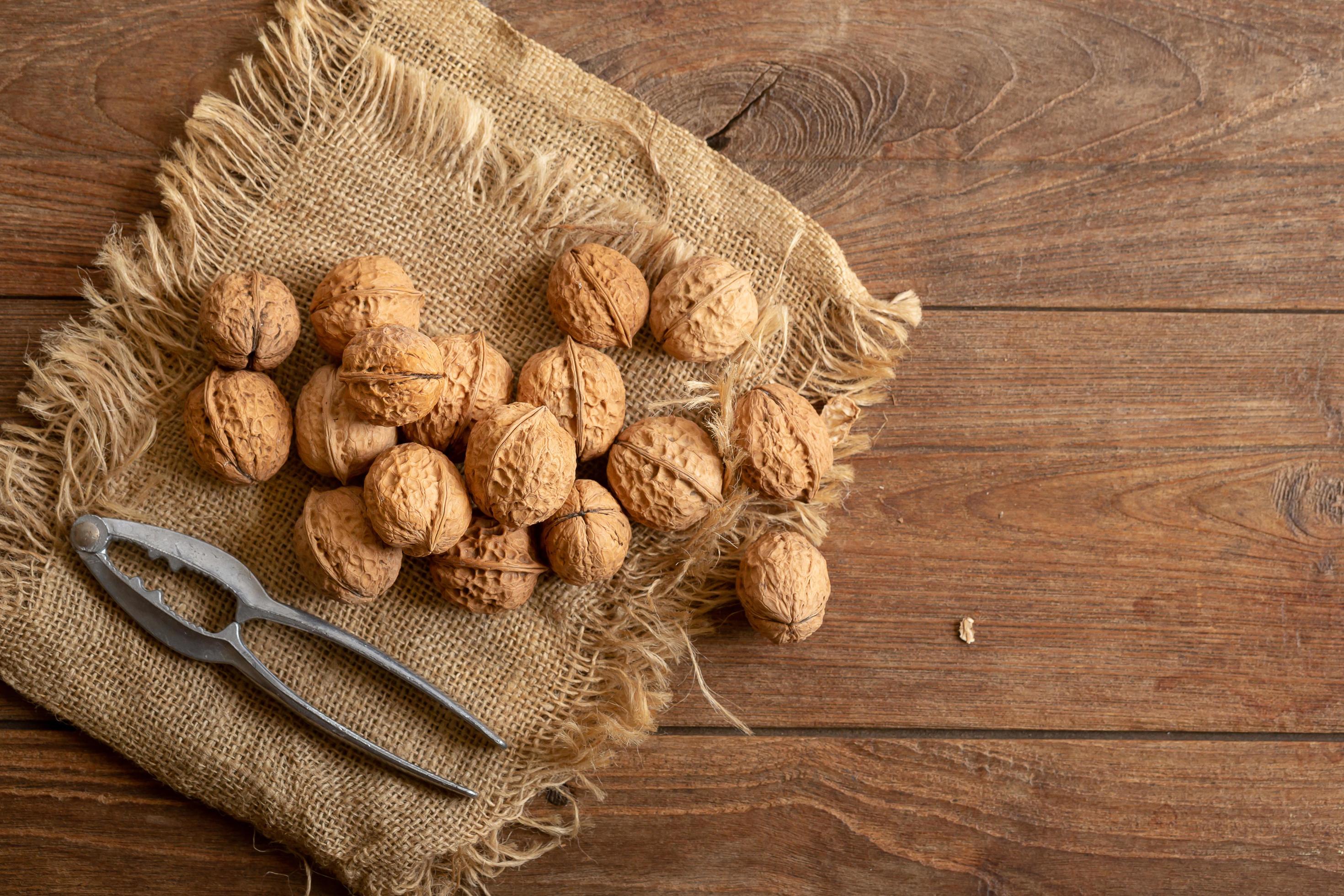 Walnuts on dark vintage table, Walnut healthy food top view Stock Free