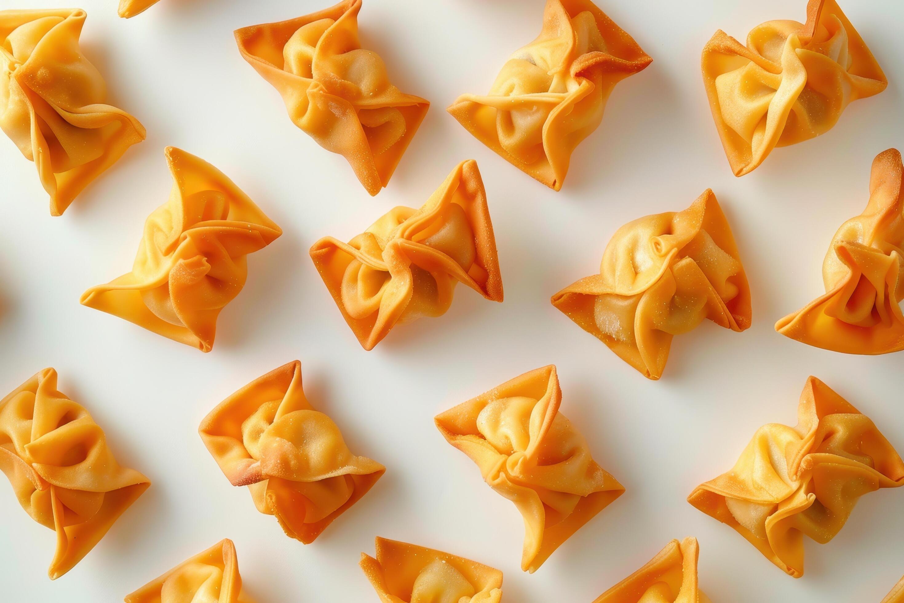 Close-up of Golden Fried Wonton Dumplings on White Background Stock Free