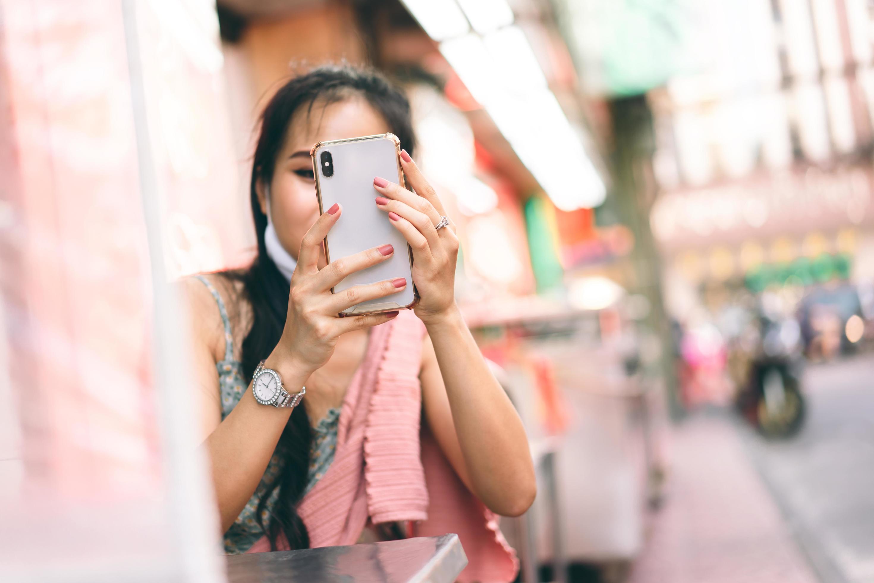 New normal lifestyle asian woman using smart phone. at outdoor Stock Free