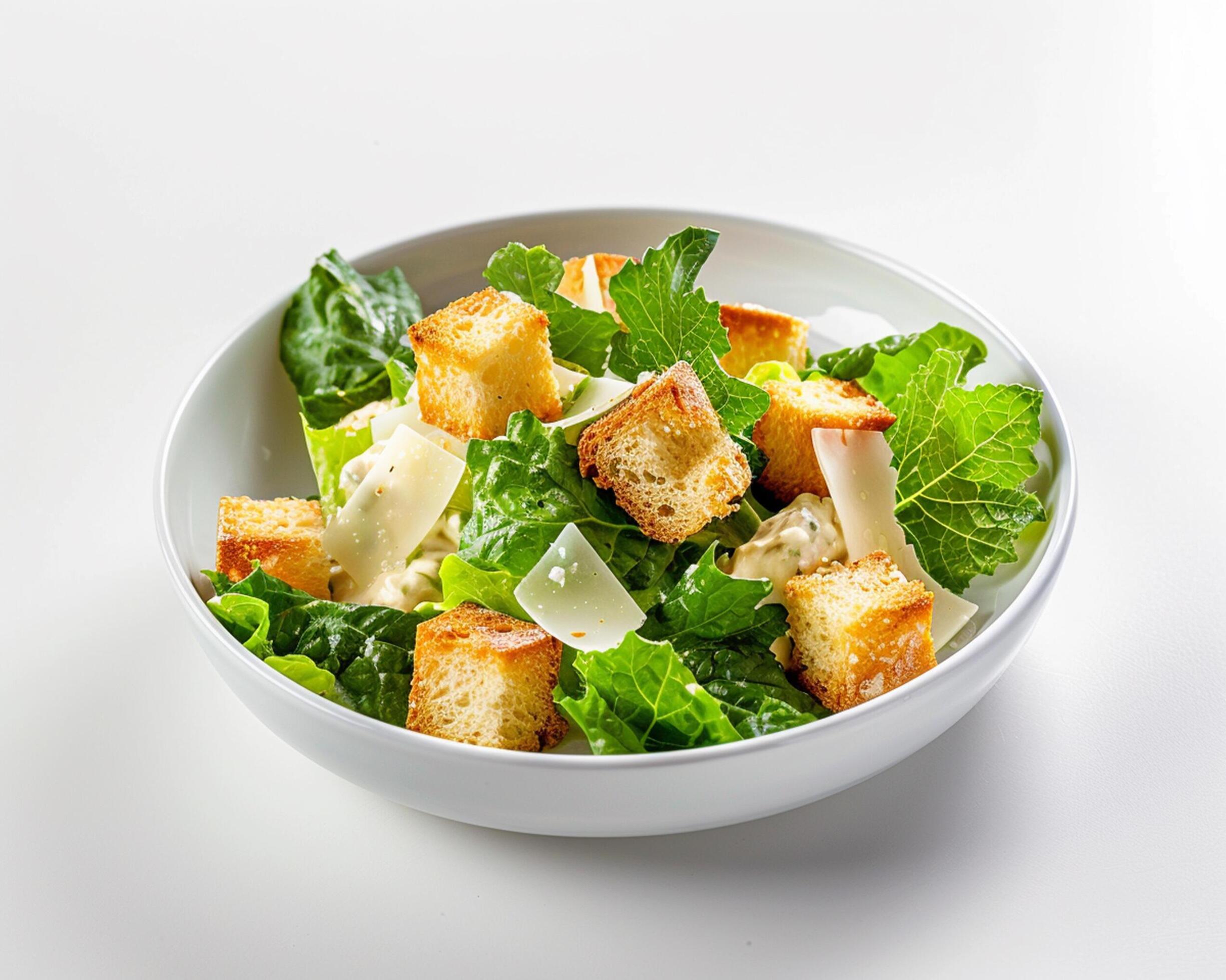 a white bowl with a salad Stock Free