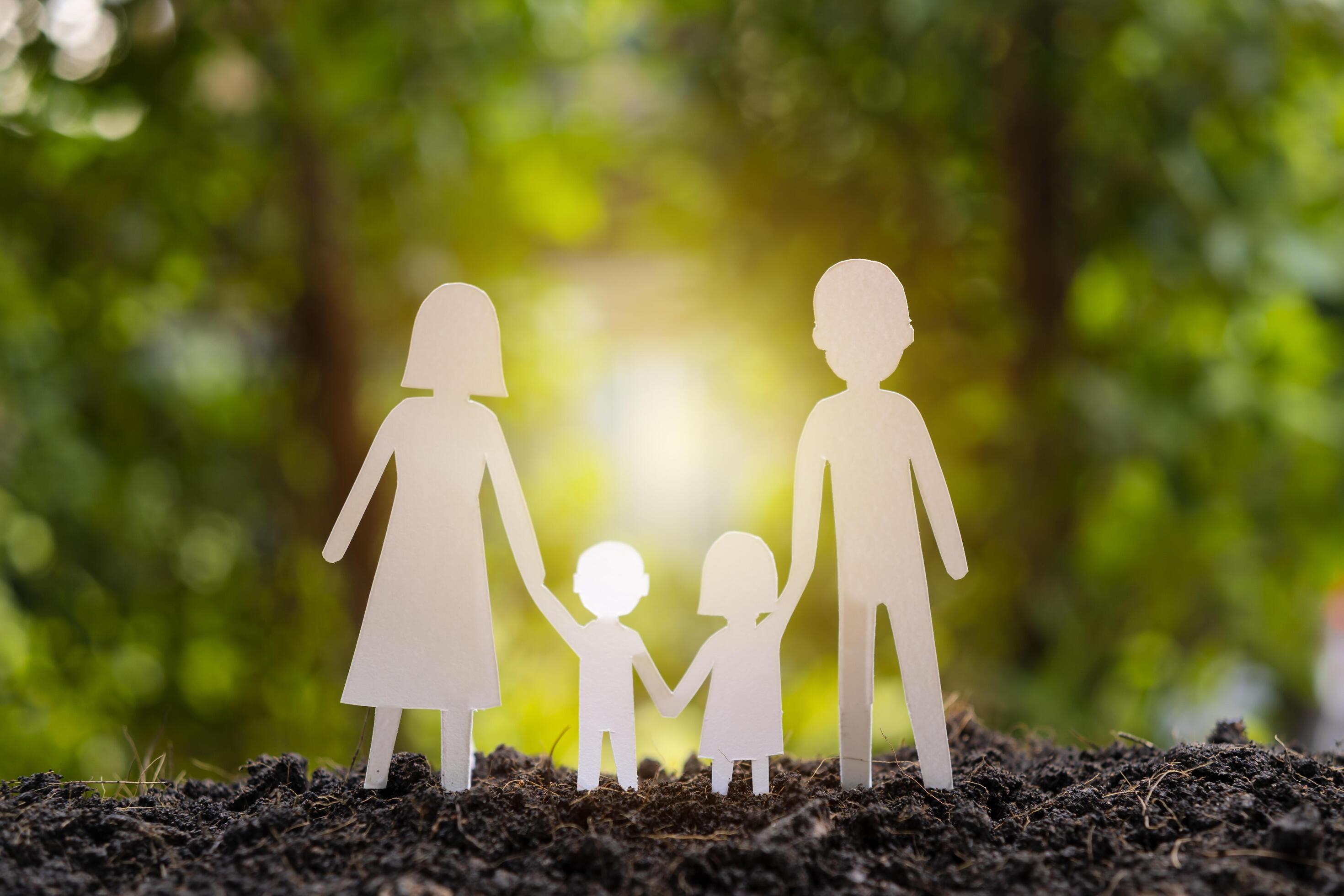 Family paper cut with a flower background on the ground Stock Free