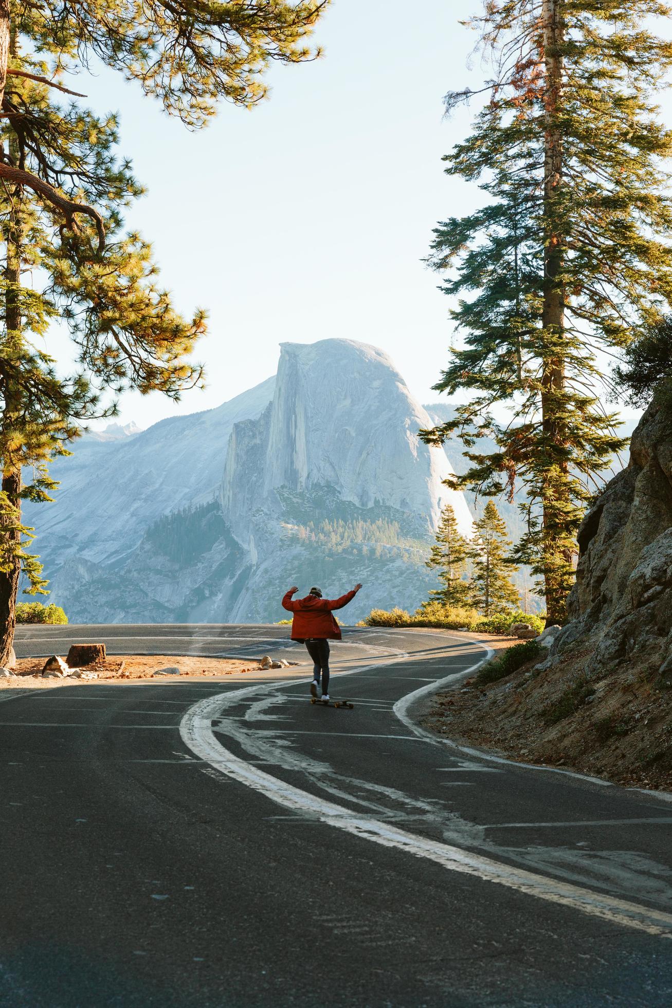 Man skateboarding in front of Half Dome Stock Free