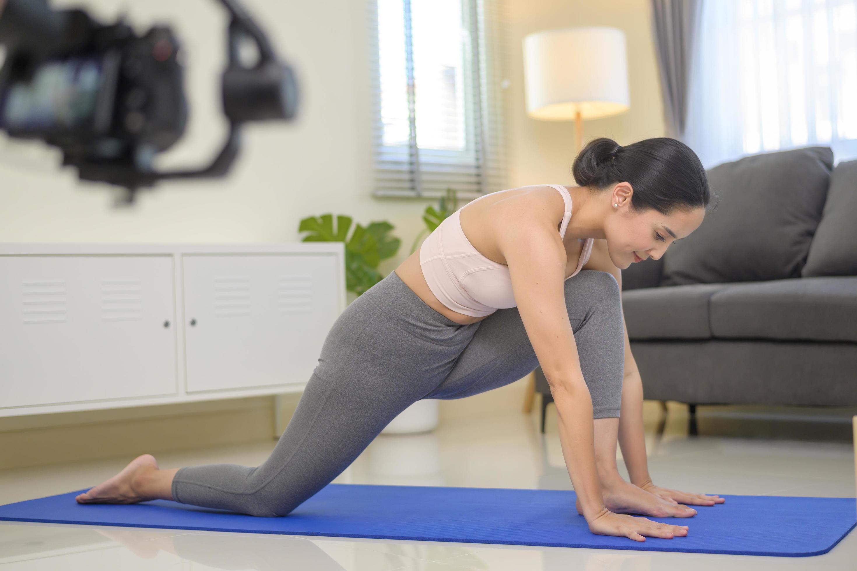 Behind the scenes of Fit young woman doing yoga and meditation at home, sport and healthy lifestyle concept. Stock Free