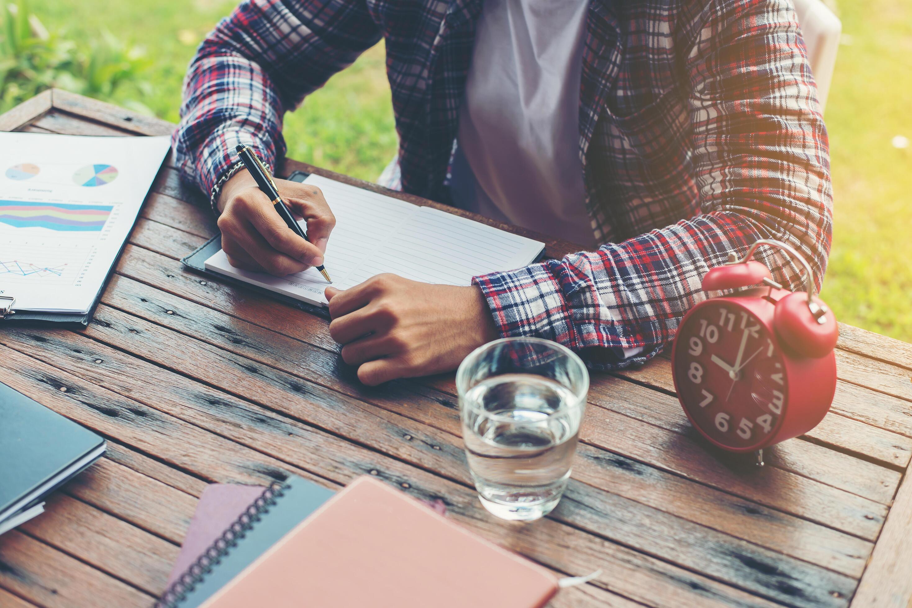 Hipster Businessman Working writing Determine Workspace Lifestyle Concept. Stock Free