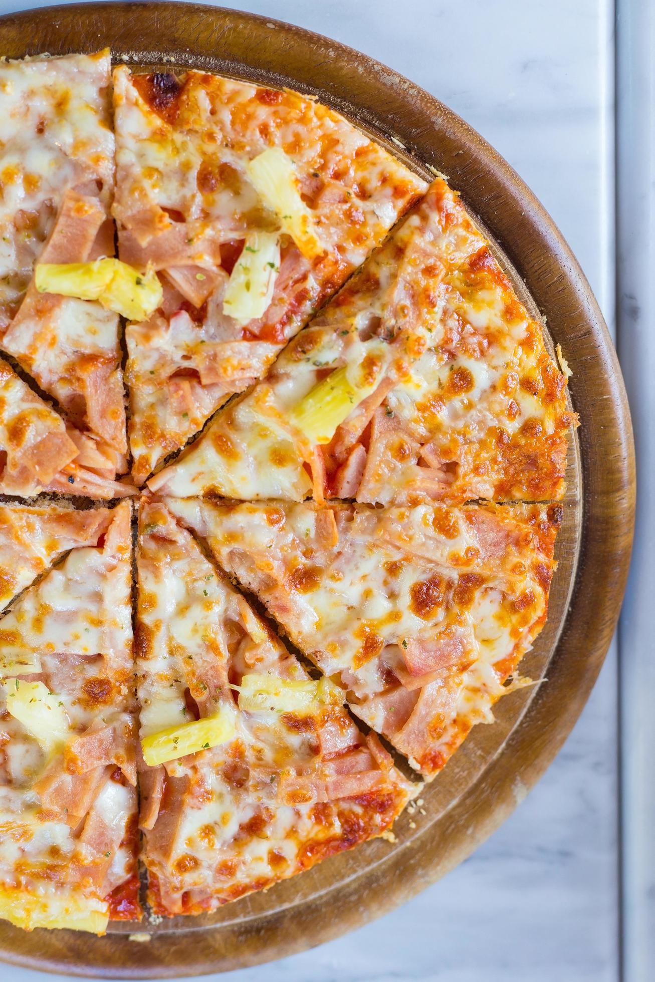 Hawaiian pizza is a Italian food which it made with tomato sauce, chopped pineapple, ham and cheese. Stock Free