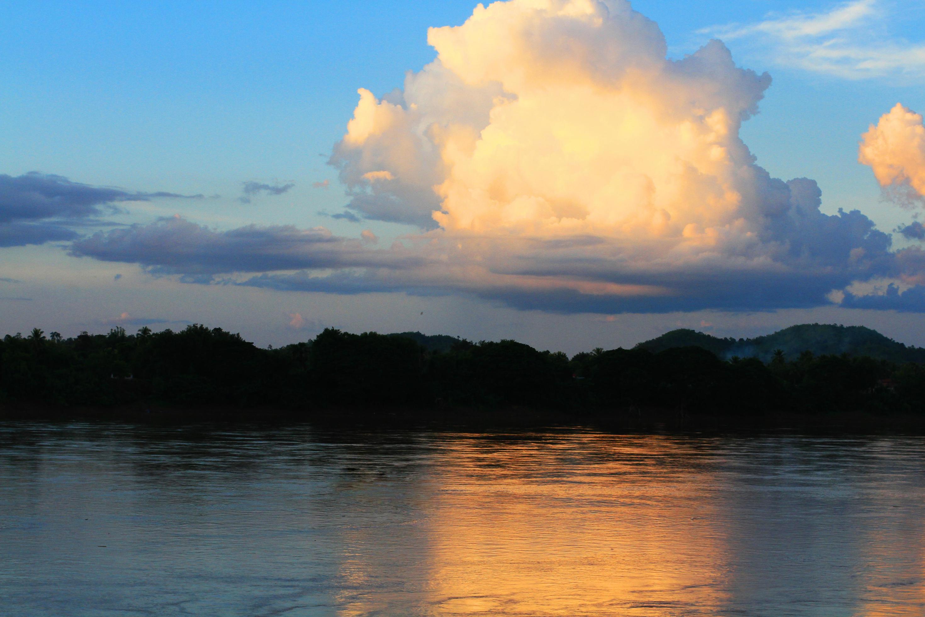 Tradition of Long tail boat and fisherman in beautiful sunset twilight at Khong river the Thai-Laos border Chaingkhan distric Thailand Stock Free