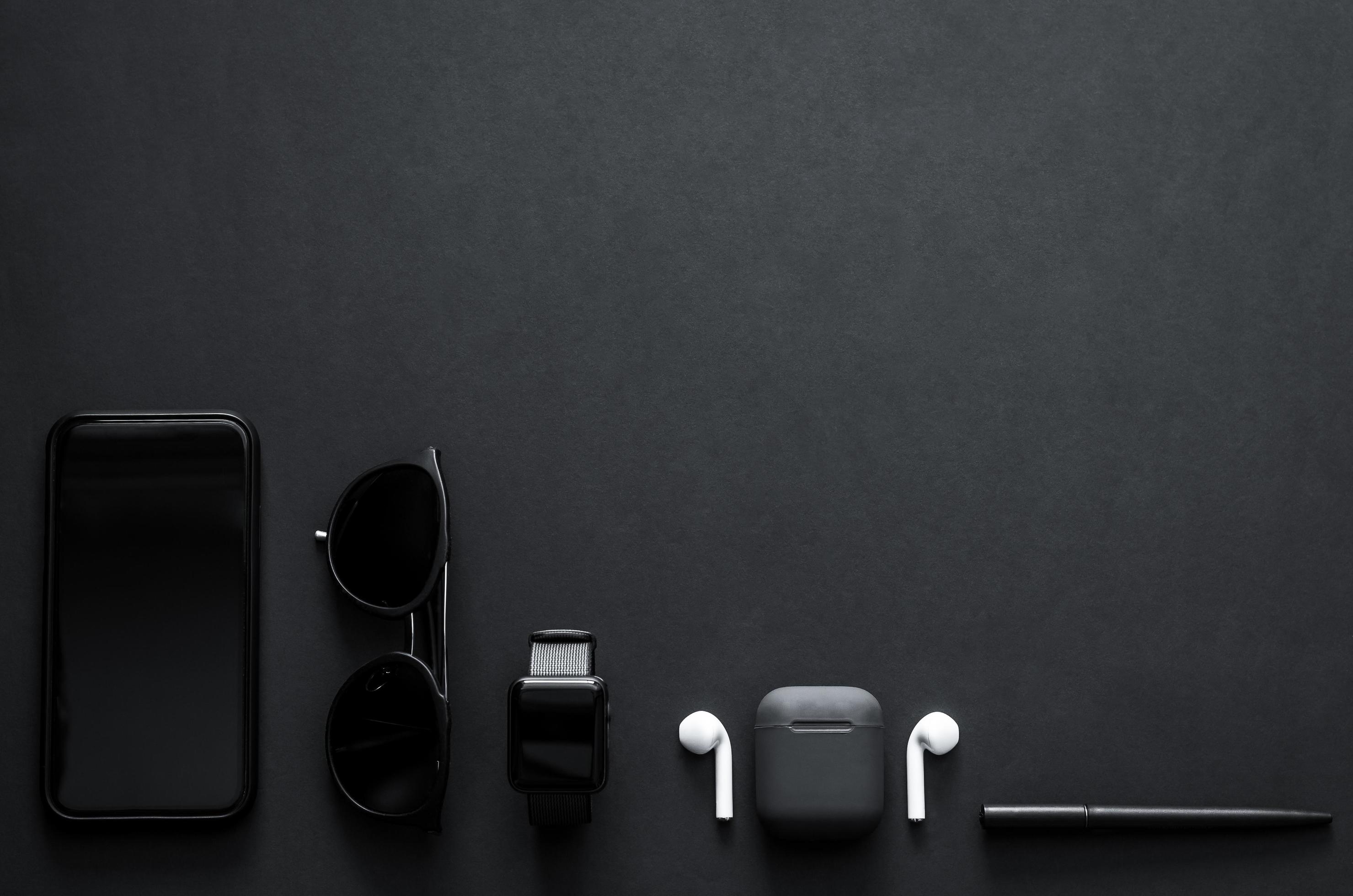 Men gadgets in modern lifestyle on dark background for minimalist flat lay black concept. Stock Free