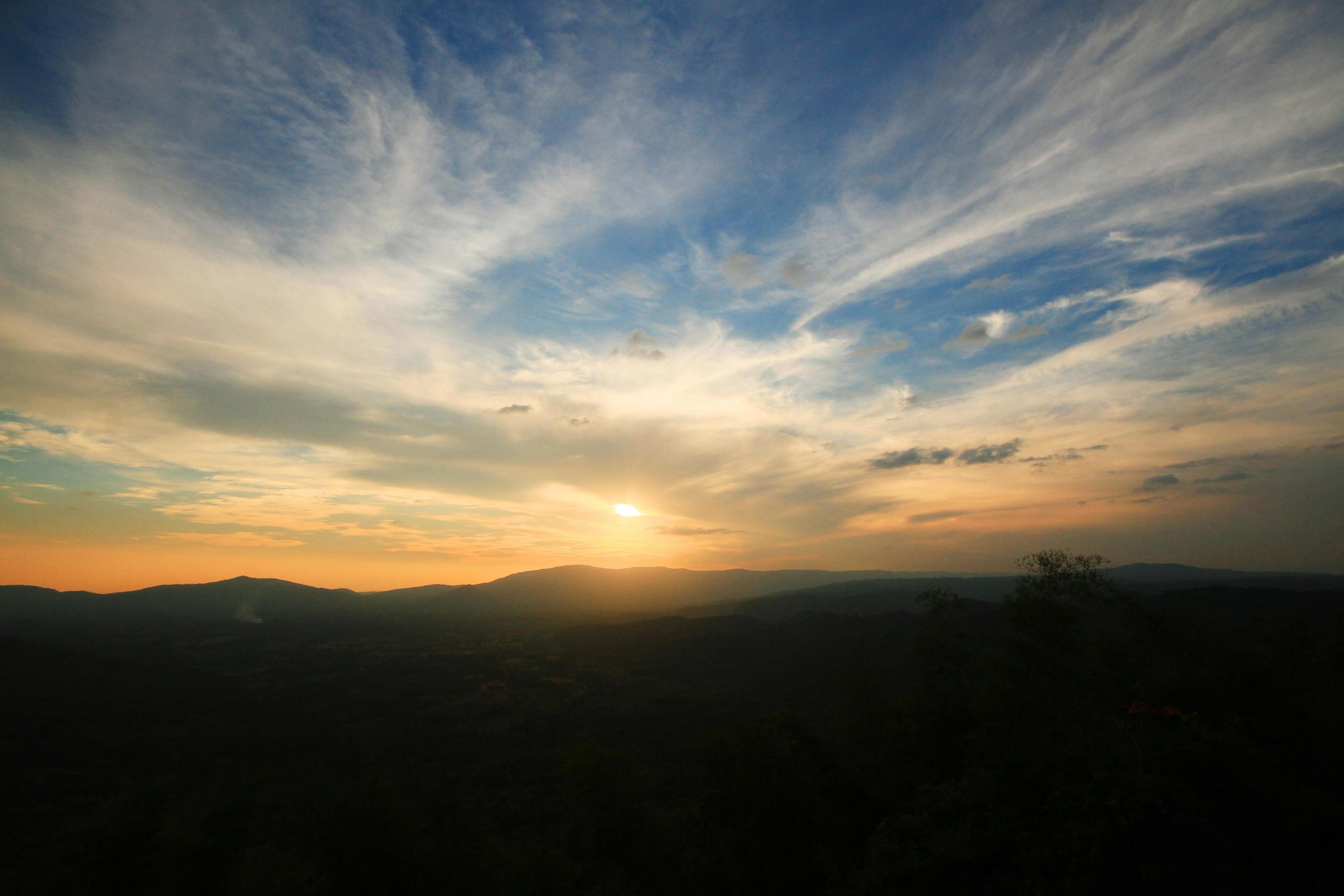 Beautiful landscape layers of mountain and Misty on hill valley in golden twilight of sunset at Thailand Stock Free