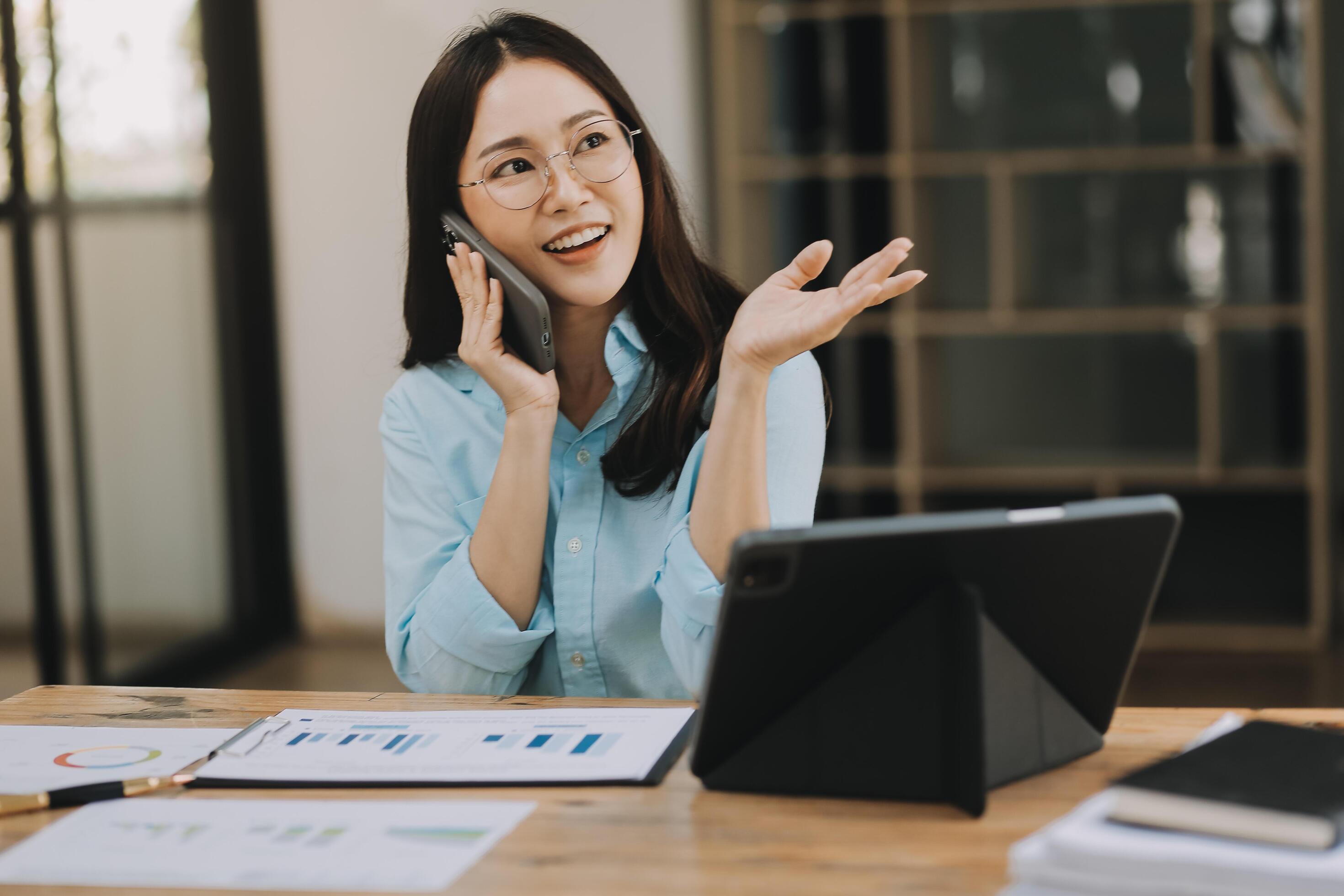 Asian woman working at the office. woman using laptop computer on desk at office Stock Free