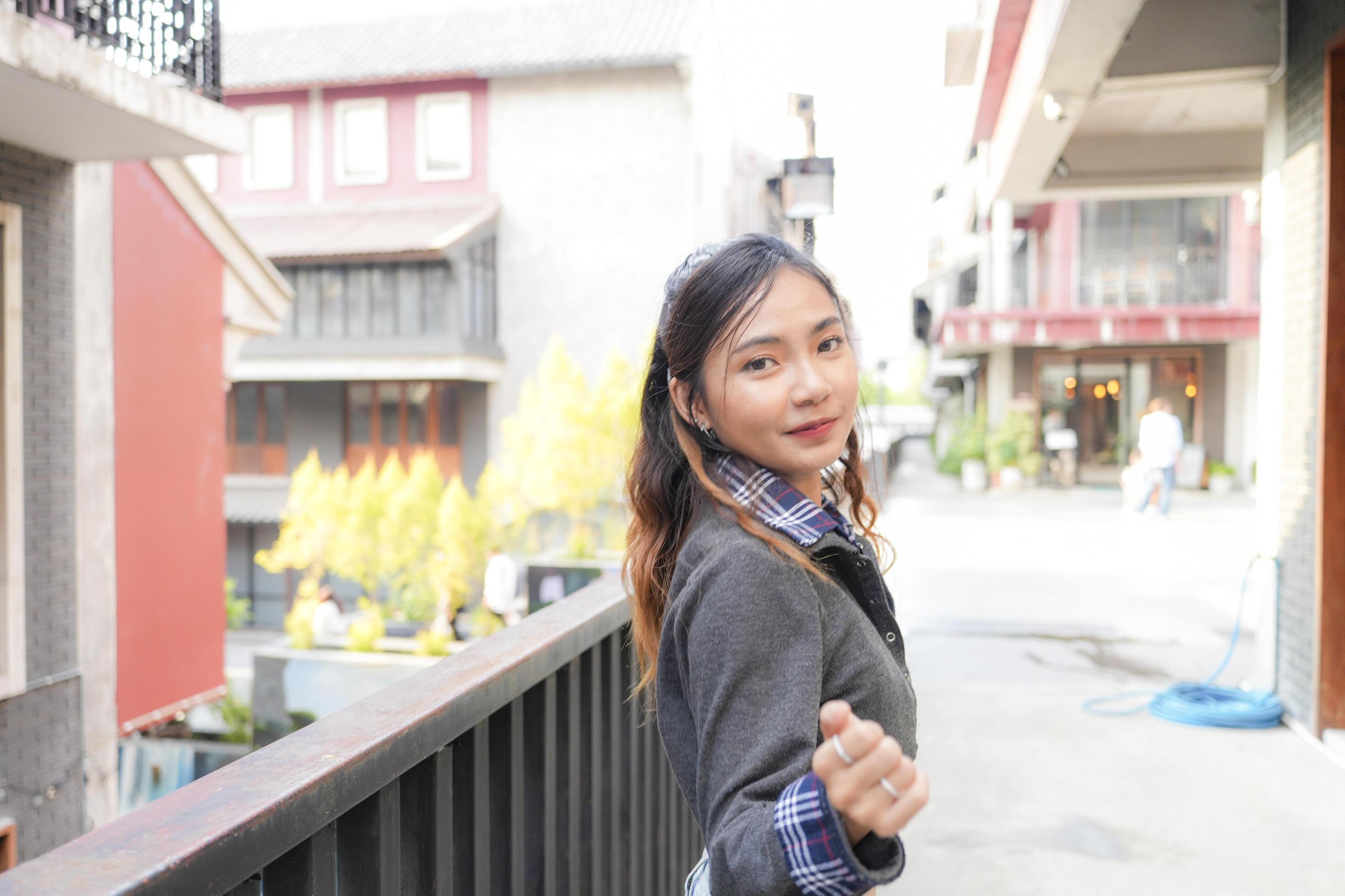 Asian women do freestyle hip hop and breakdancing in a public space in the middle of the city. With a cheerful and happy attitude Stock Free