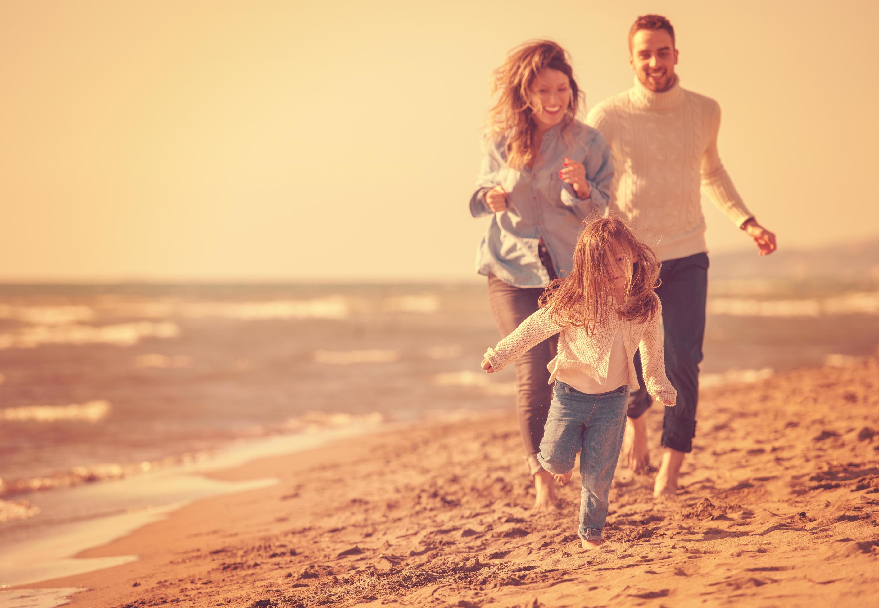 Young family enjoying vecation during autumn Stock Free