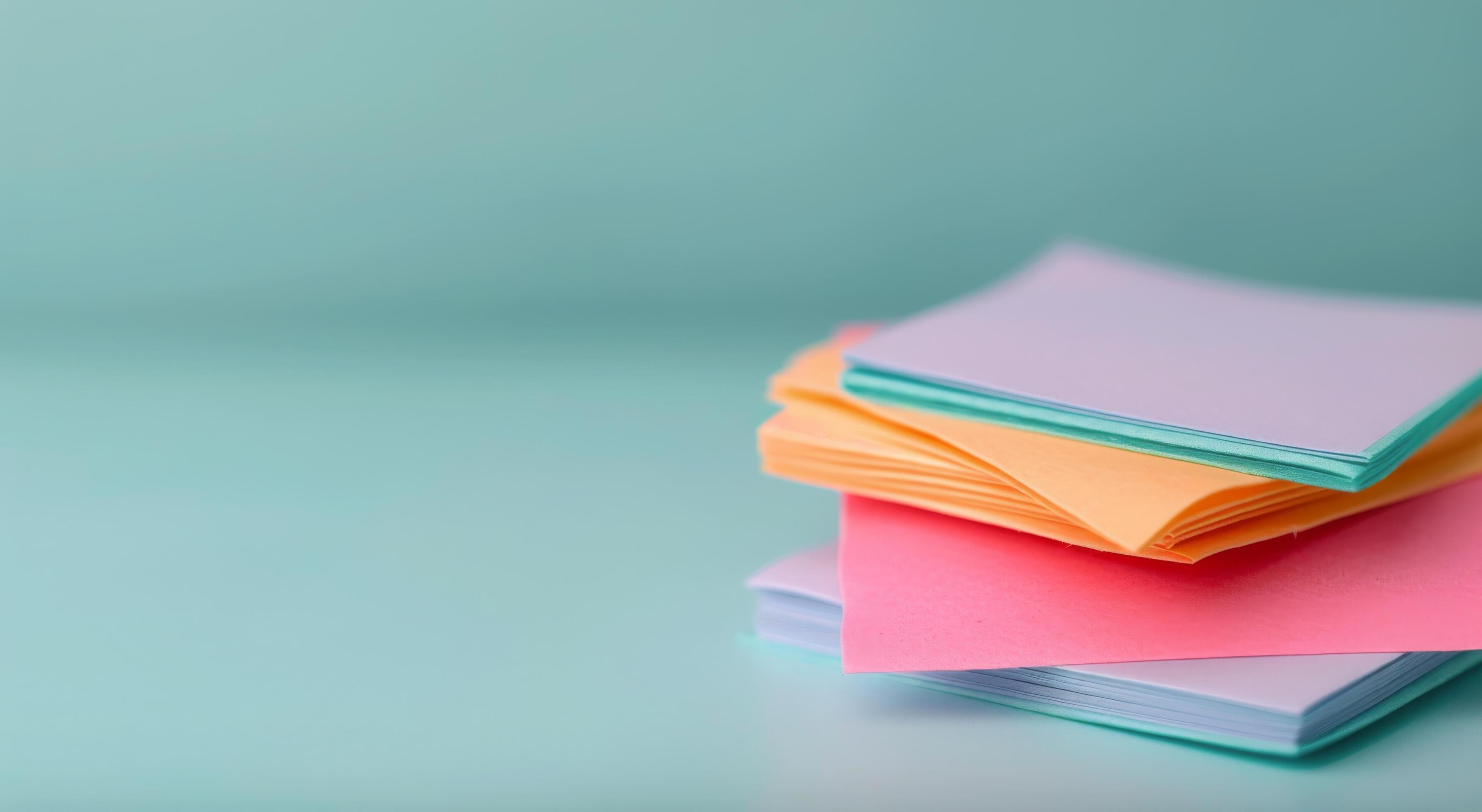 Colorful Foam Sheets Stacked on a Turquoise Surface With Soft Background Stock Free