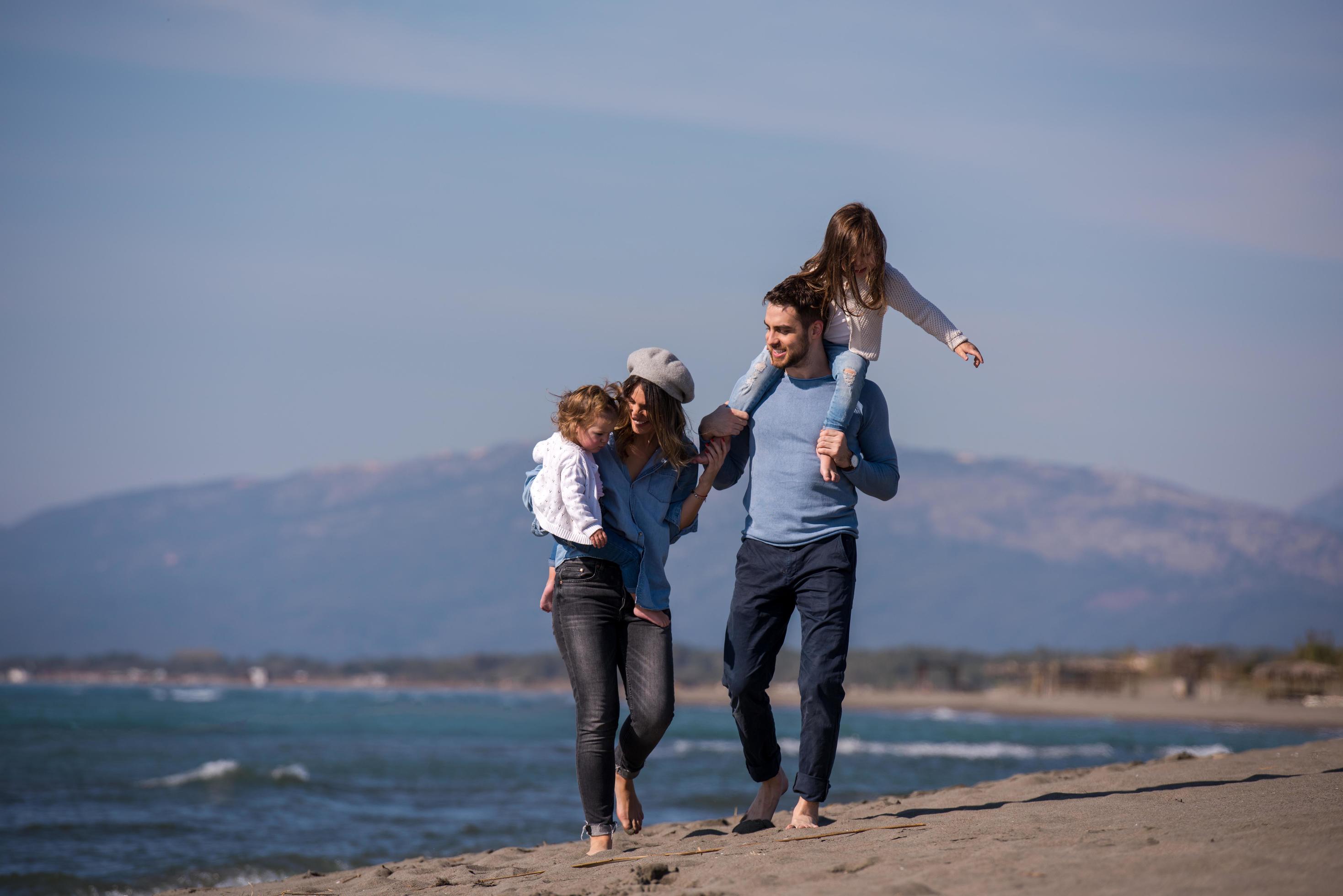 Young family enjoying vecation during autumn Stock Free