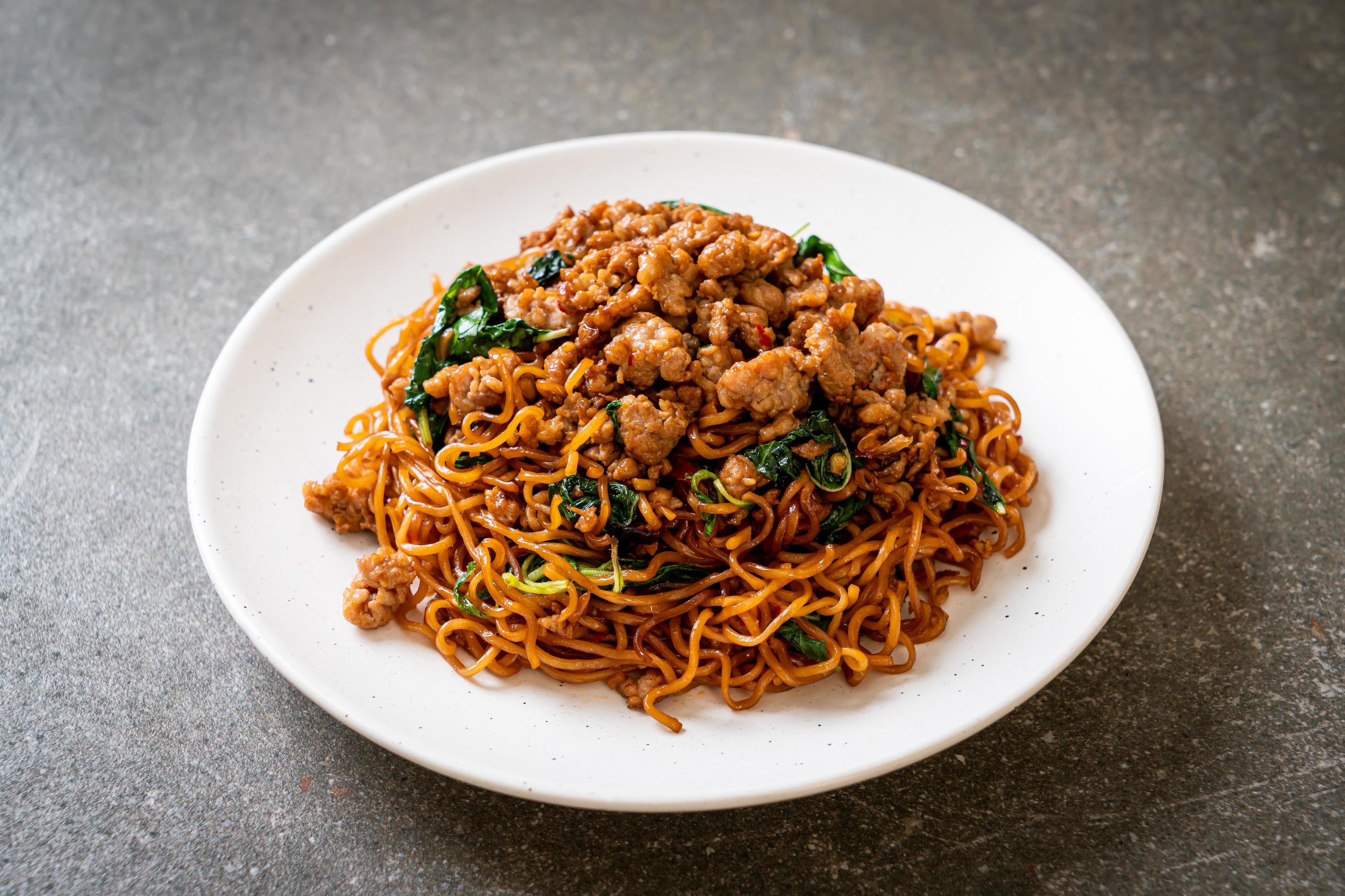 
									Stir-fried instant noodles with Thai basil and minced pork – Asian food style Stock Free