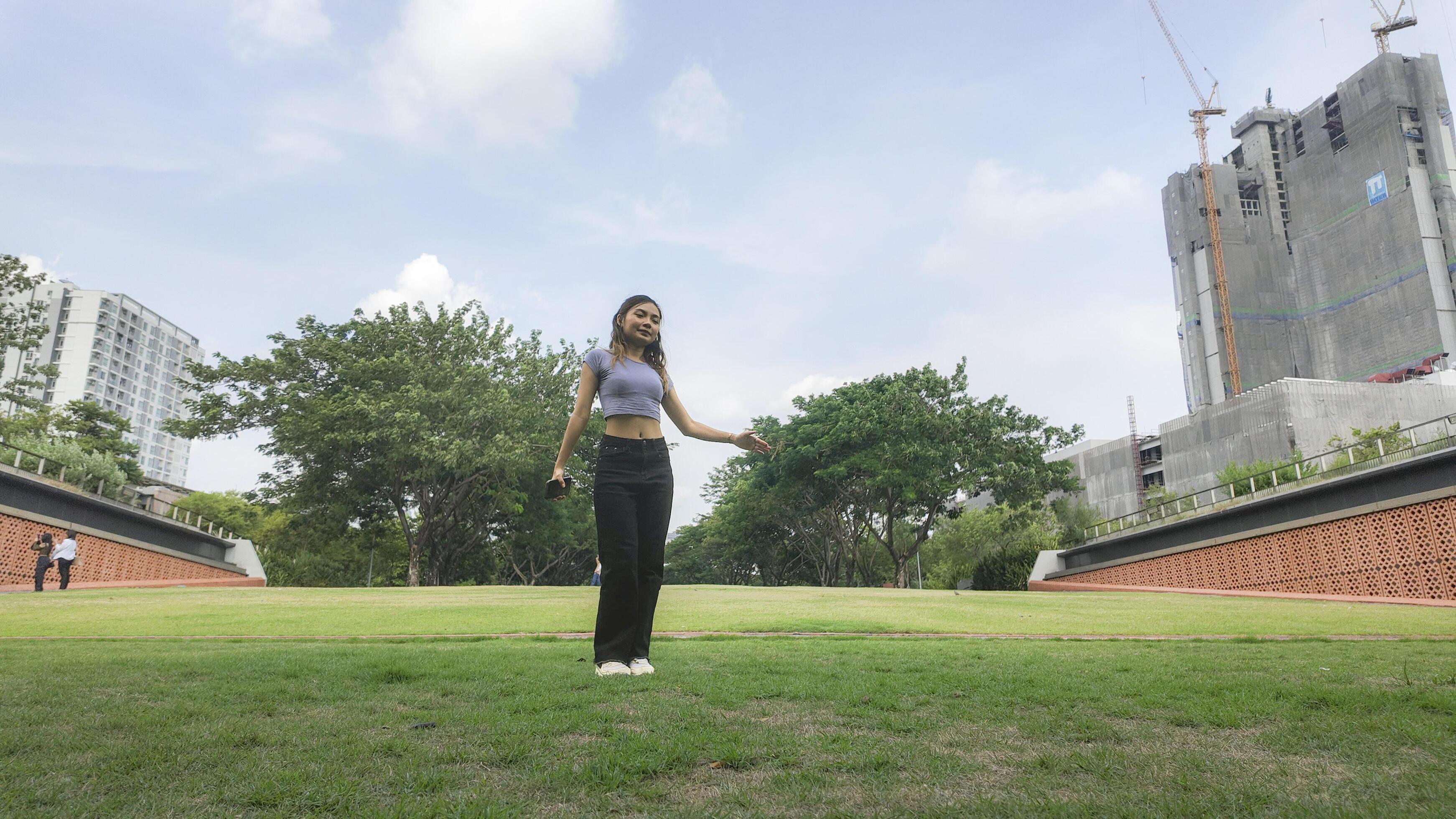 Asian women do freestyle hip hop and breakdancing in a public space in the middle of the city. With a cheerful and happy attitude Stock Free