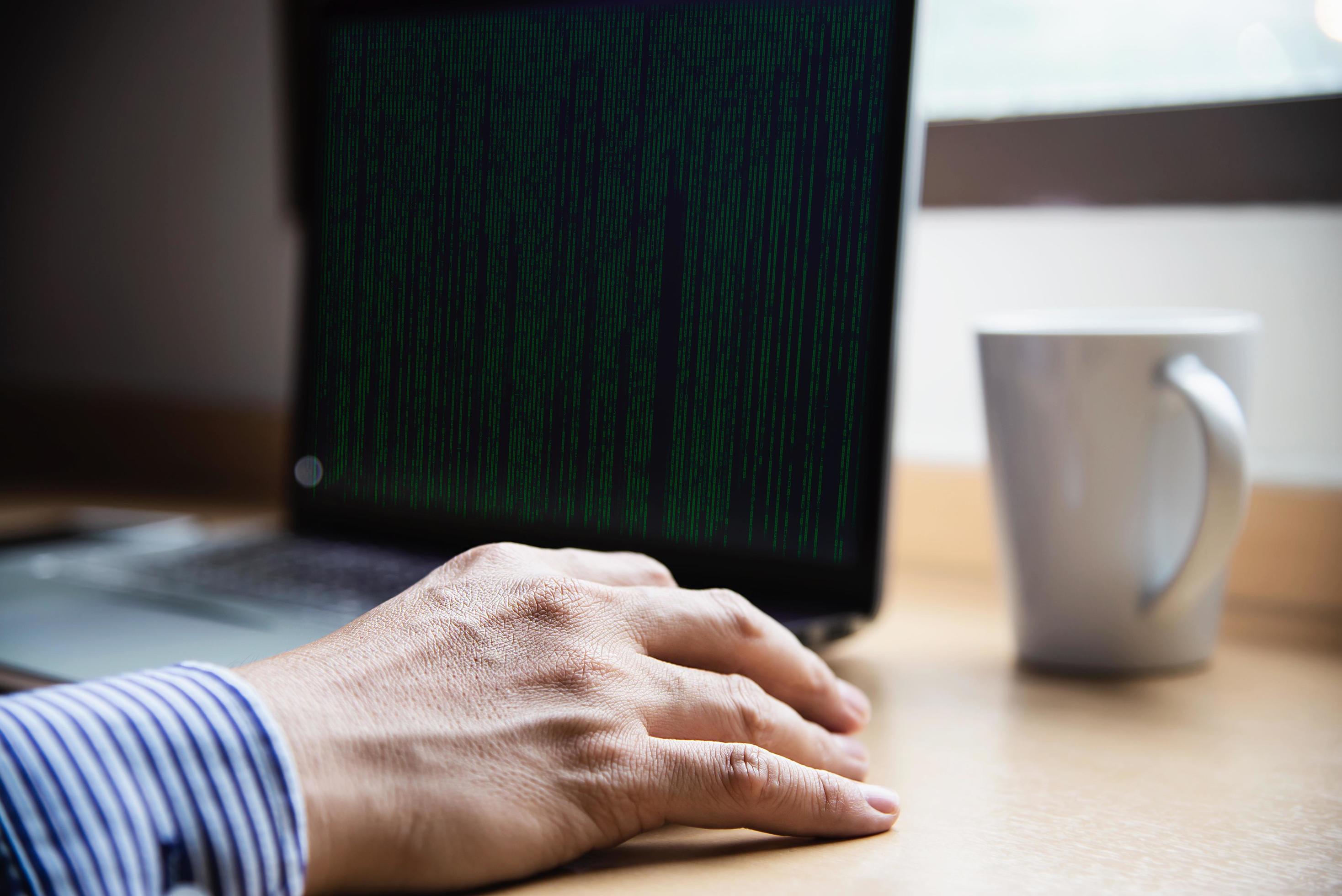 Businessman working with computer with coffee cup in the hotel room – people working lifestyle concept Stock Free