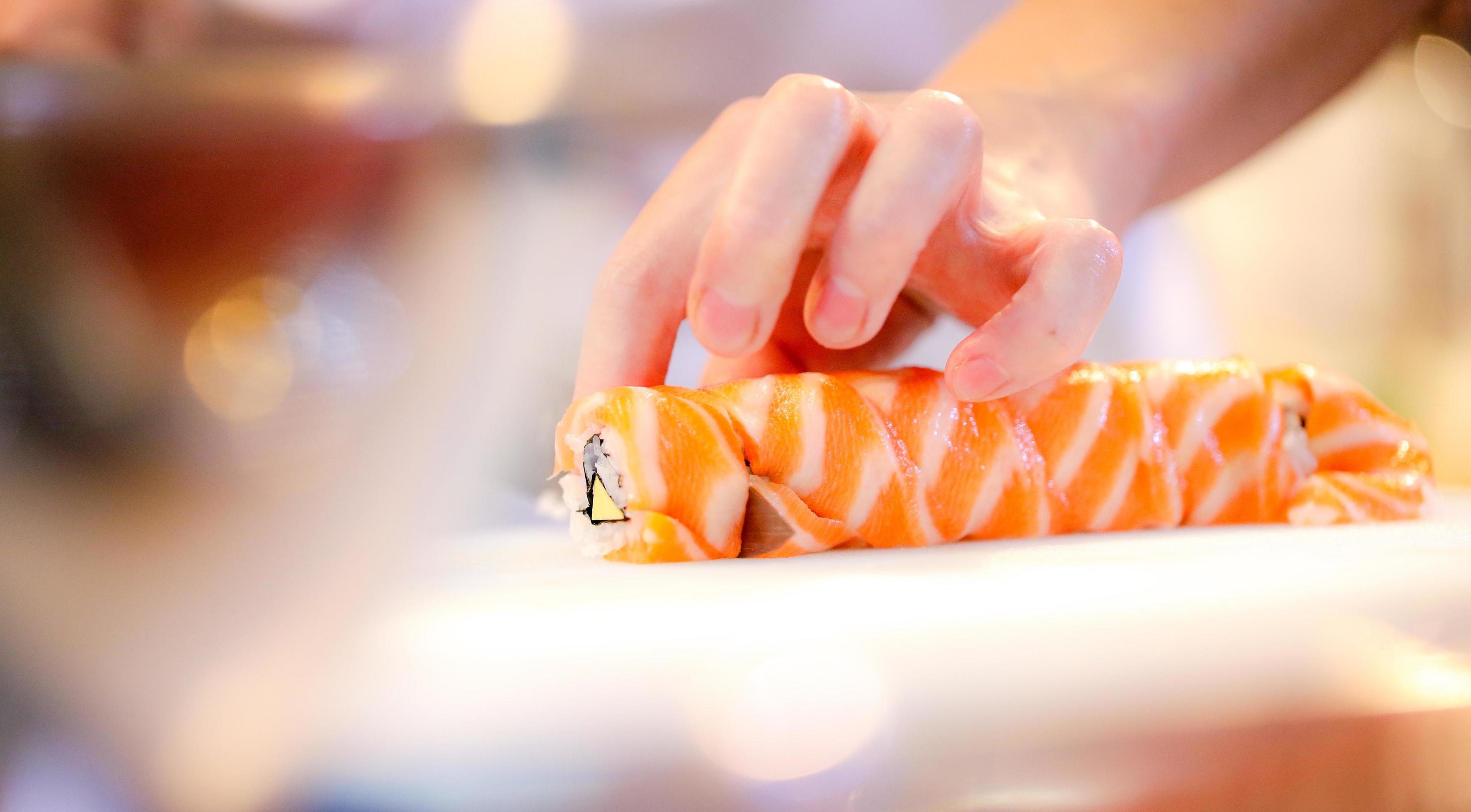 chef hands preparing japanese food, chef making sushi Stock Free