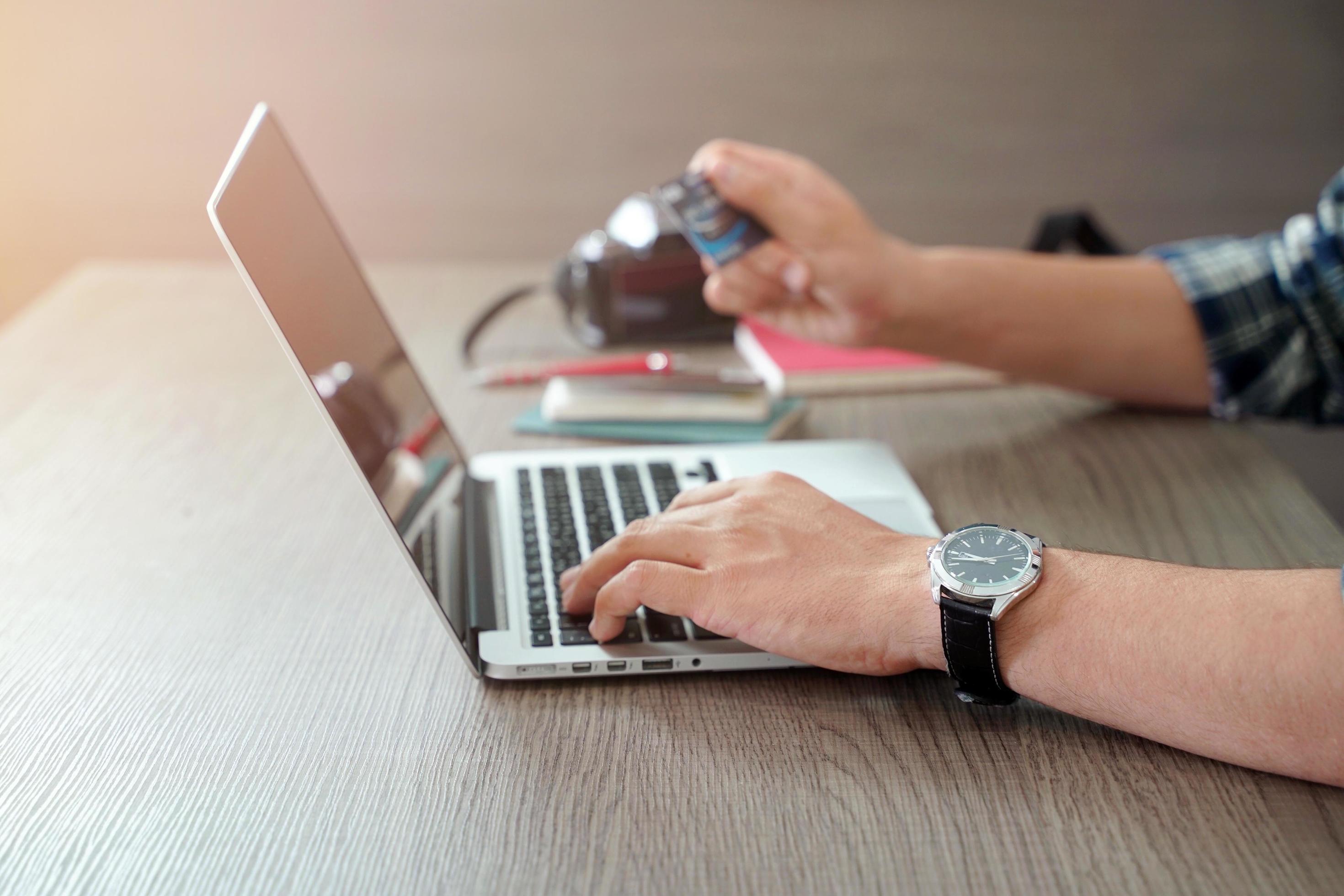 Close up young man hand shopping online by using credit card with laptop, lifestyle and technology concept Stock Free