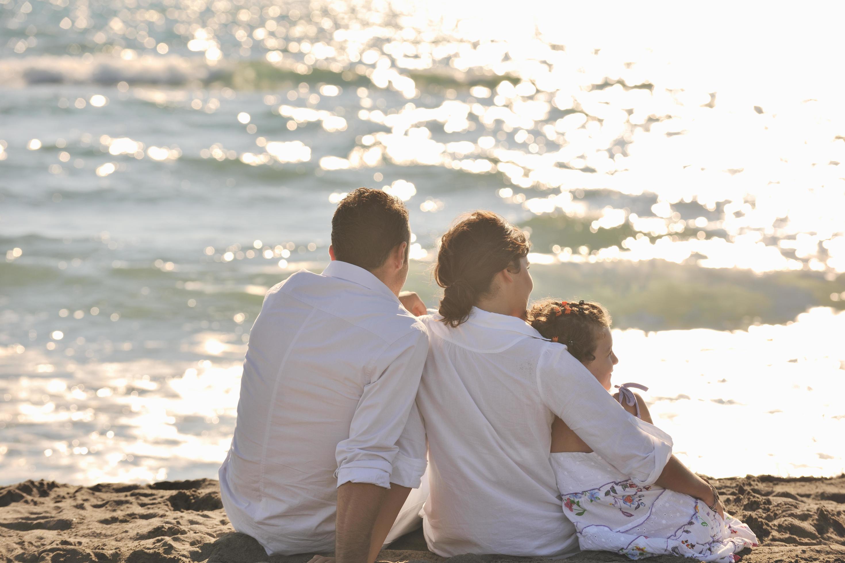 happy young family have fun on beach Stock Free