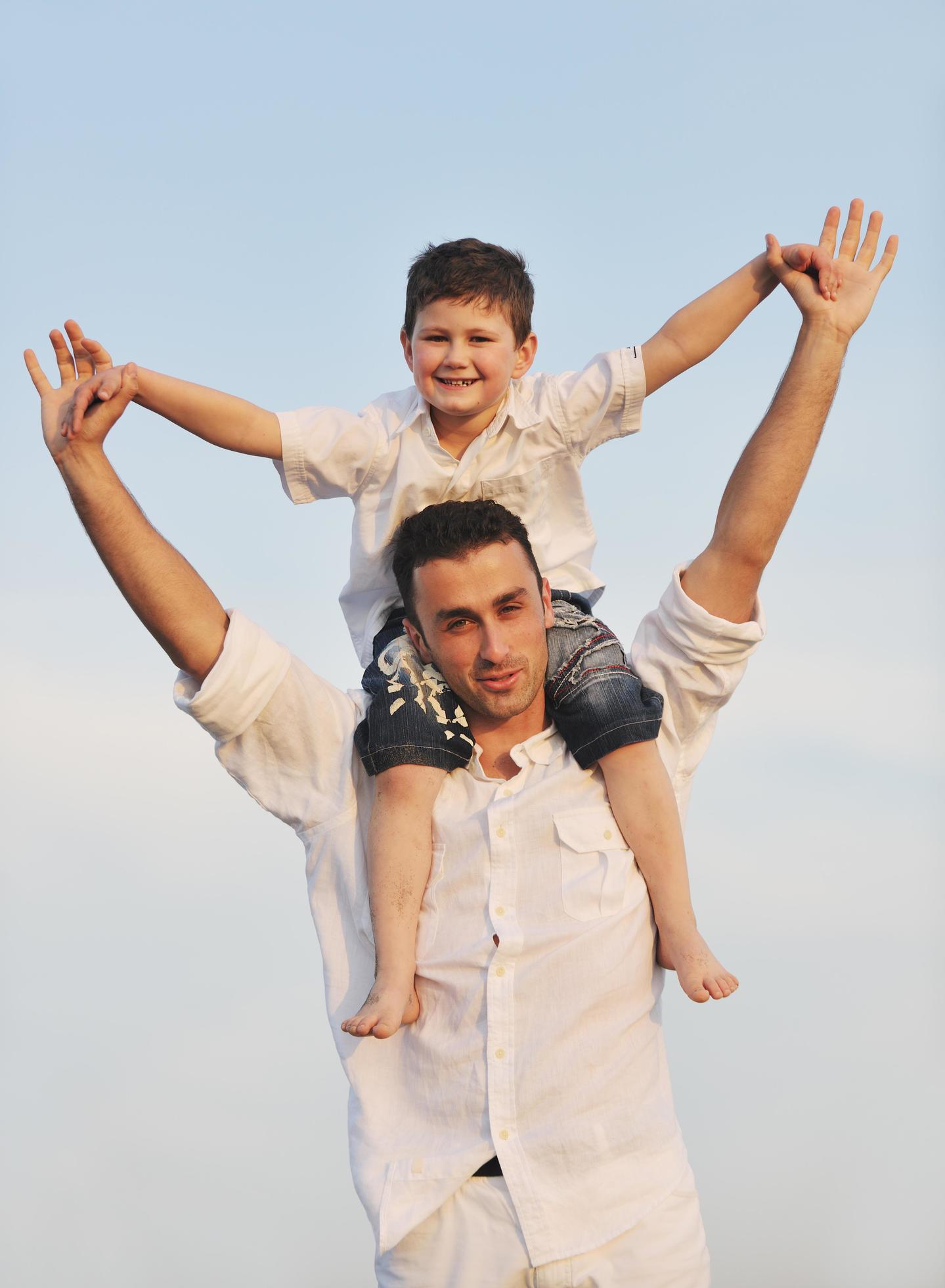 happy young family have fun on beach Stock Free