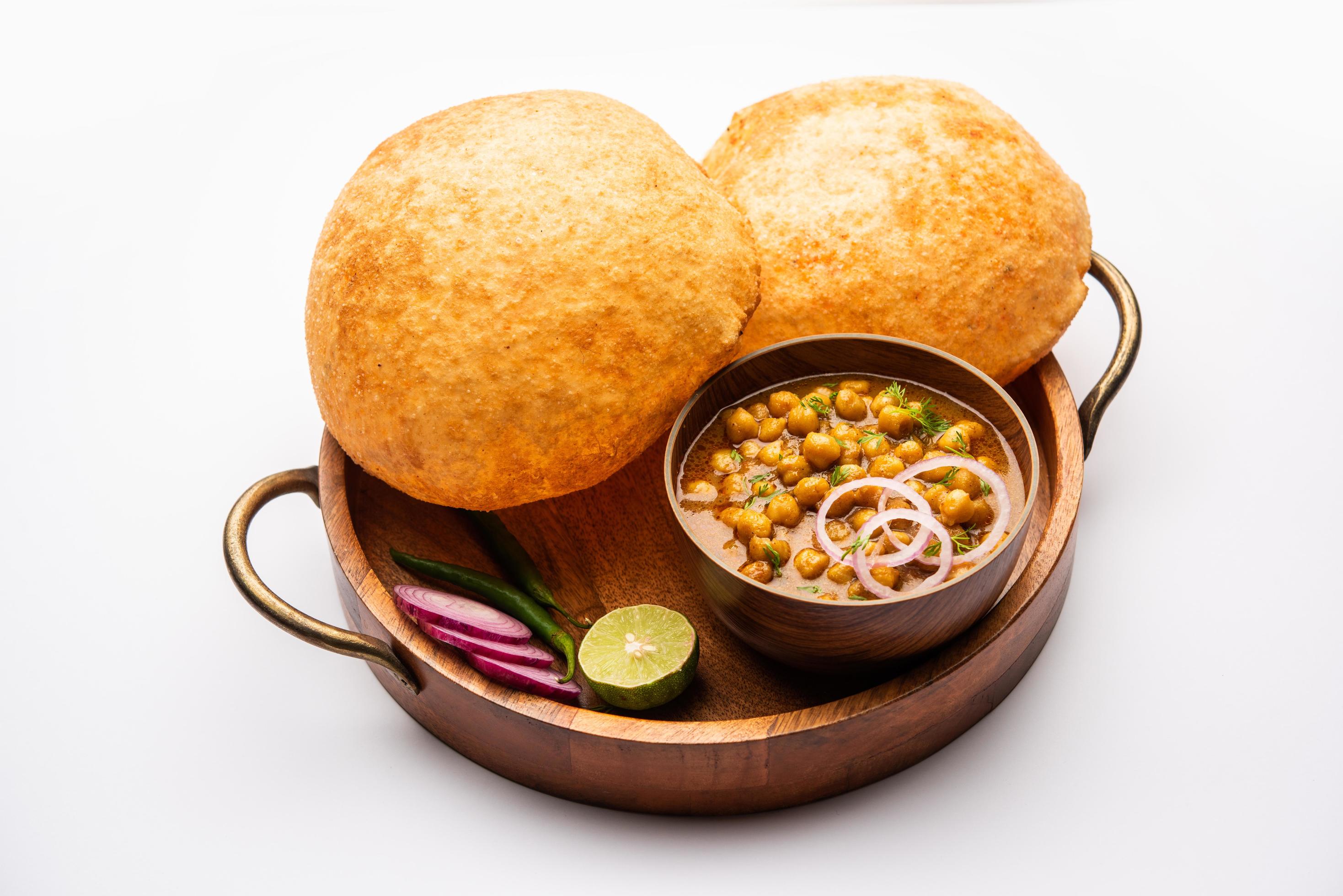 Chole bhature is a North Indian food dish. A combination of chana masala and bhatura or puri Stock Free