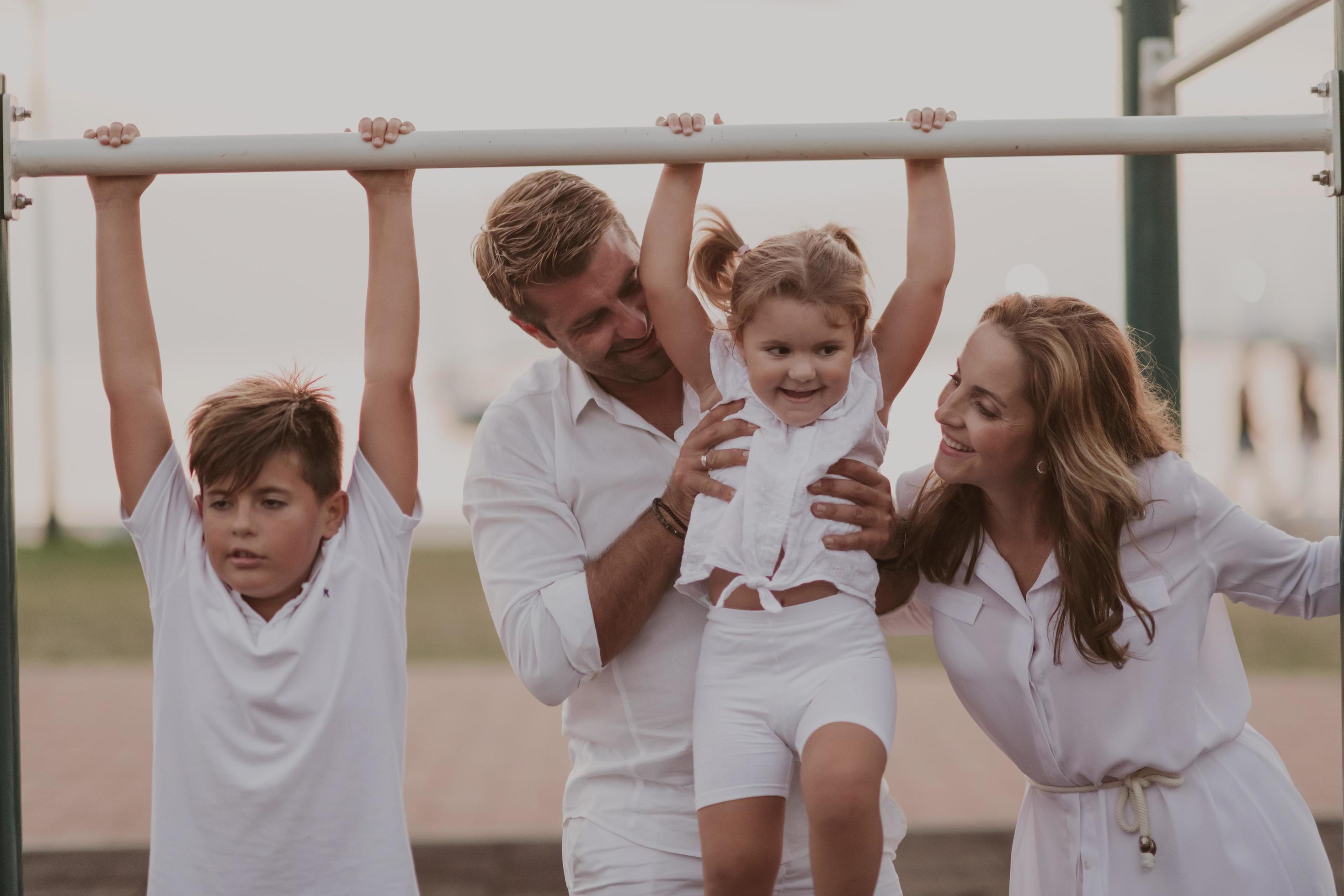 Senior couple in casual clothes with their children spending time in park a vacation together. Family time . Selective focus Stock Free