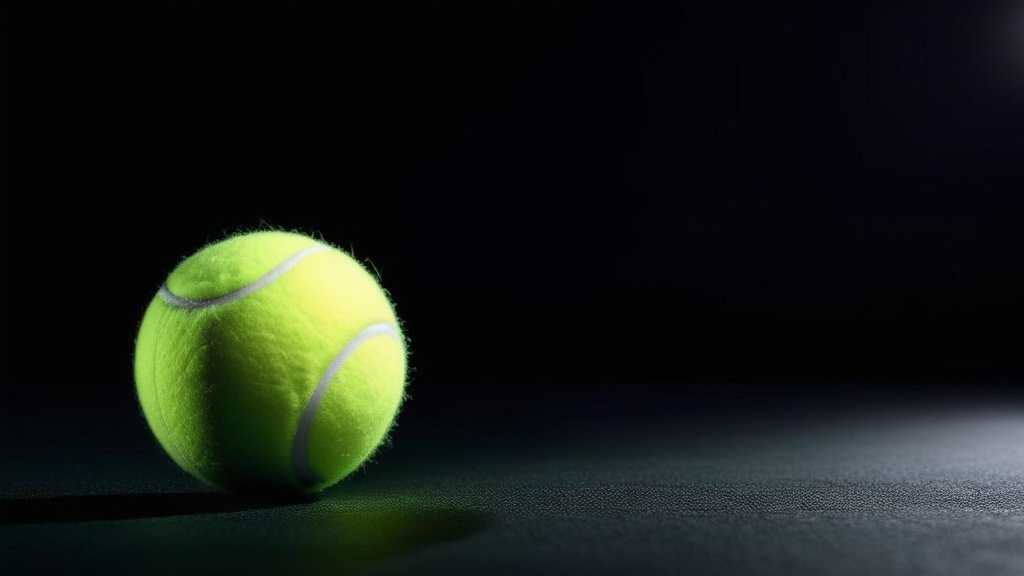 tennis ball on the dark background with copy space for text Stock Free