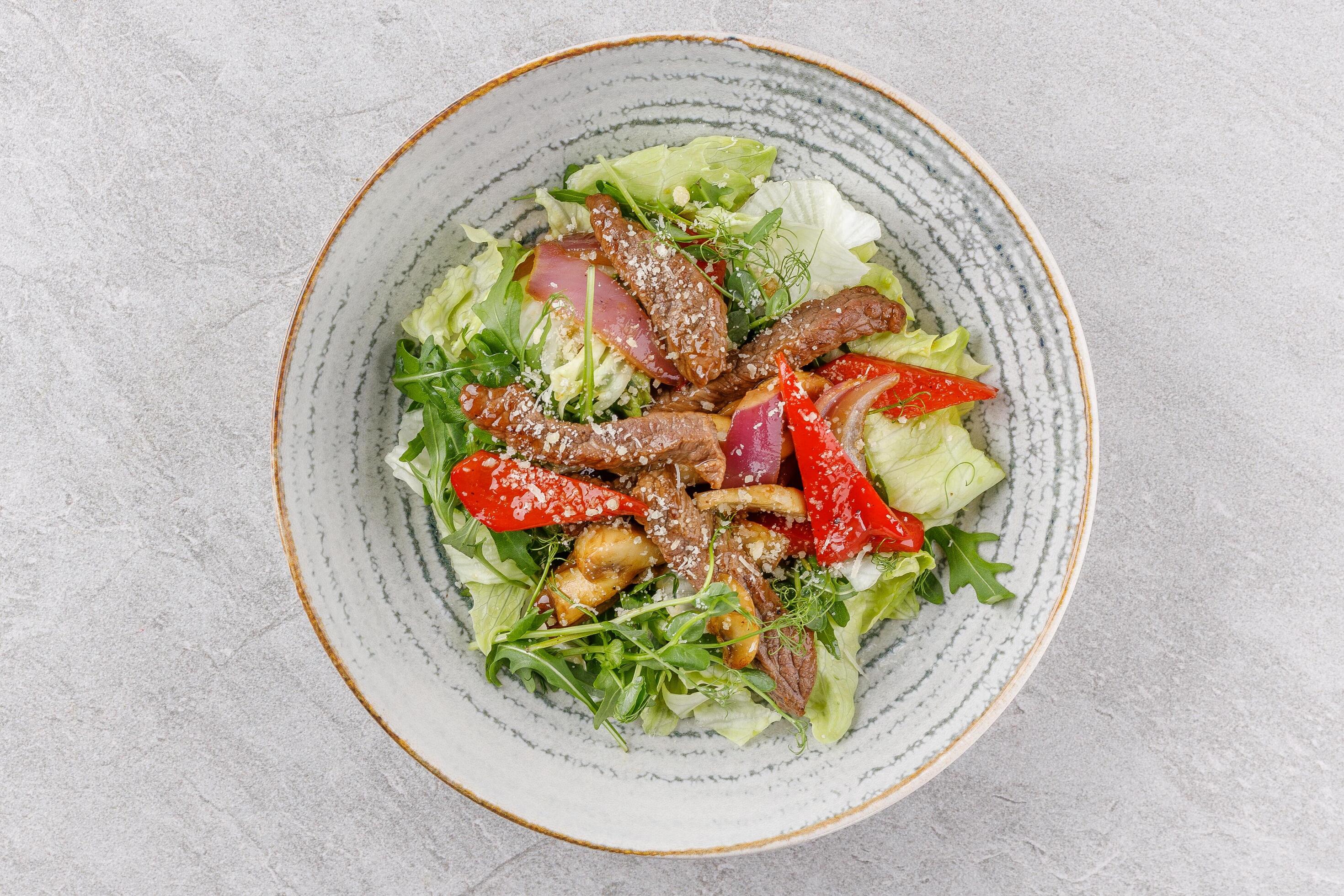 Veal salad on a stone background studio food photo 1 Stock Free