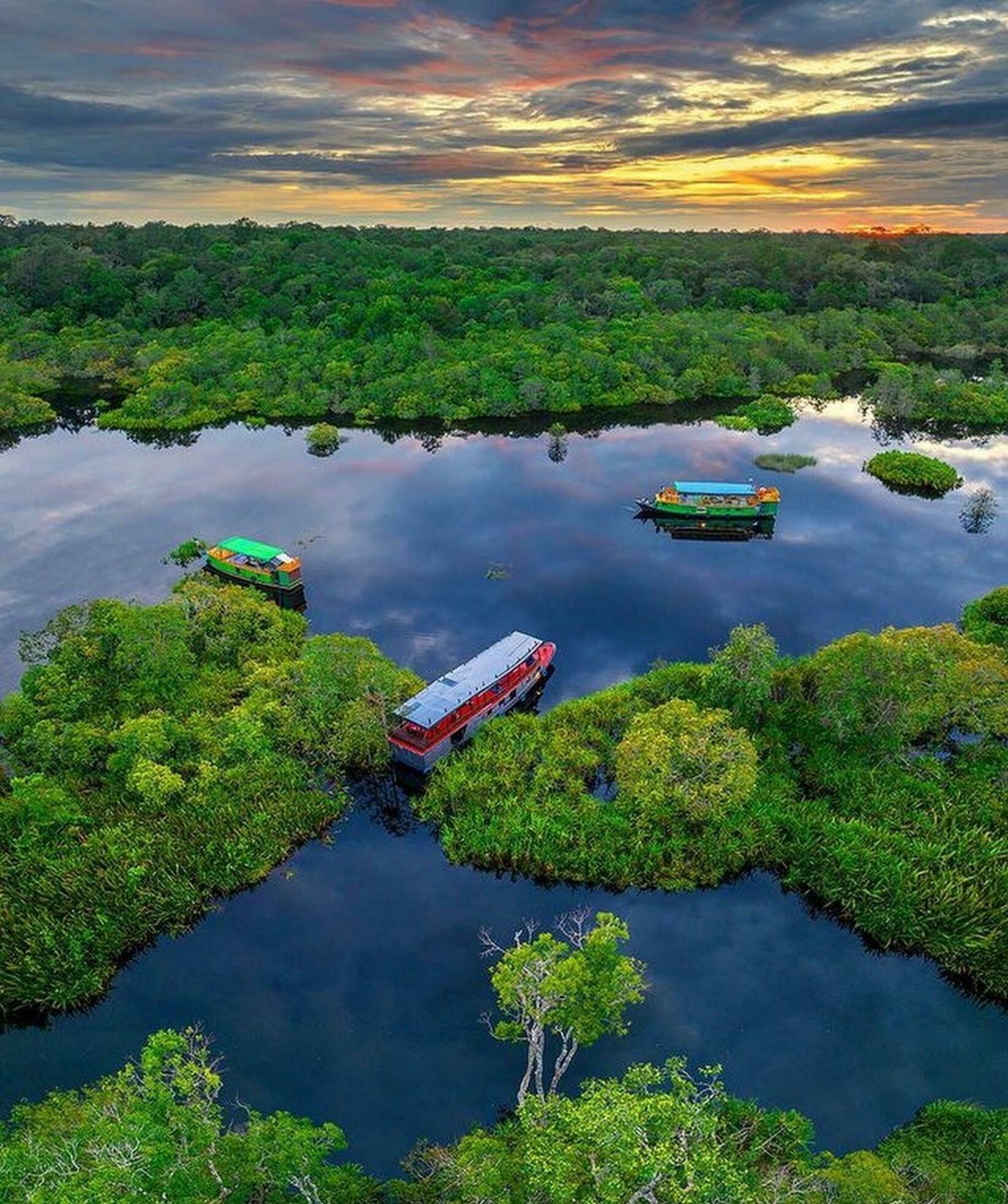 Tranquil Sunset over Reflection Lake Tranquil sunset over mirrored lake in lush nature. Stock Free