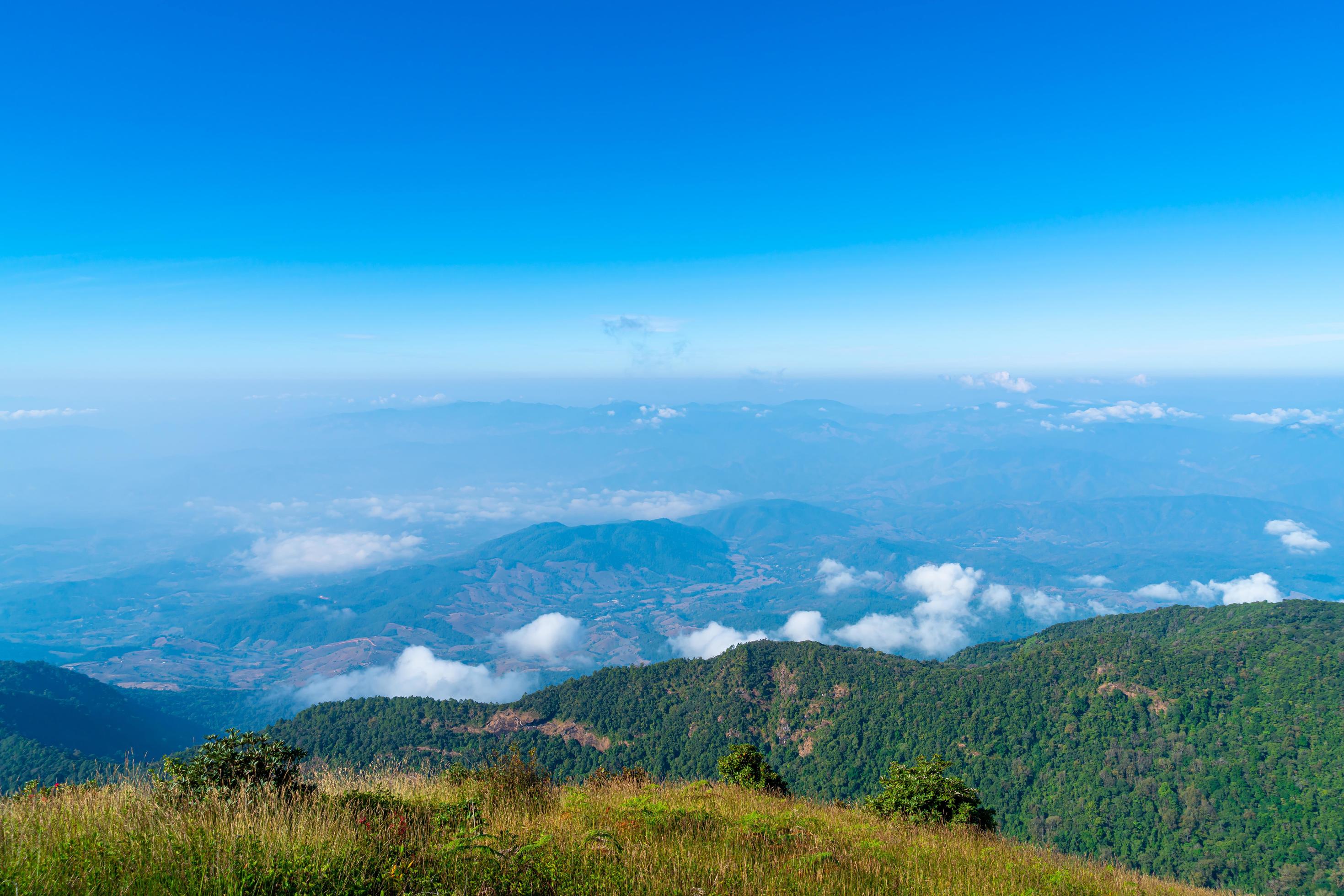 Beautiful mountain layer with clouds and blue sky at Kew Mae Pan Nature Trail in Chiang Mai, Thailand Stock Free