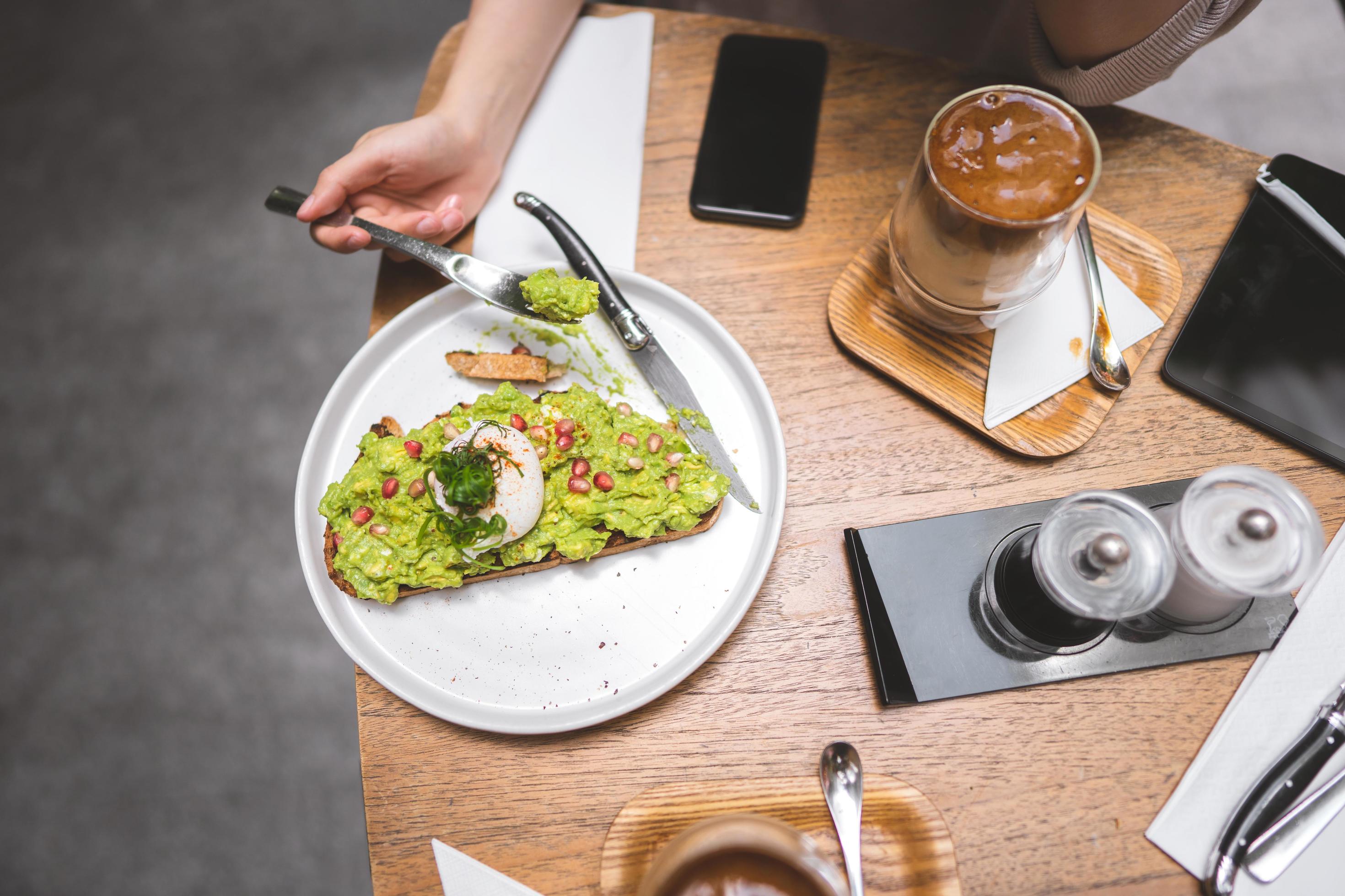 Guacamole avocado healthy food and asian woman background at outdoor restaurant on day Stock Free