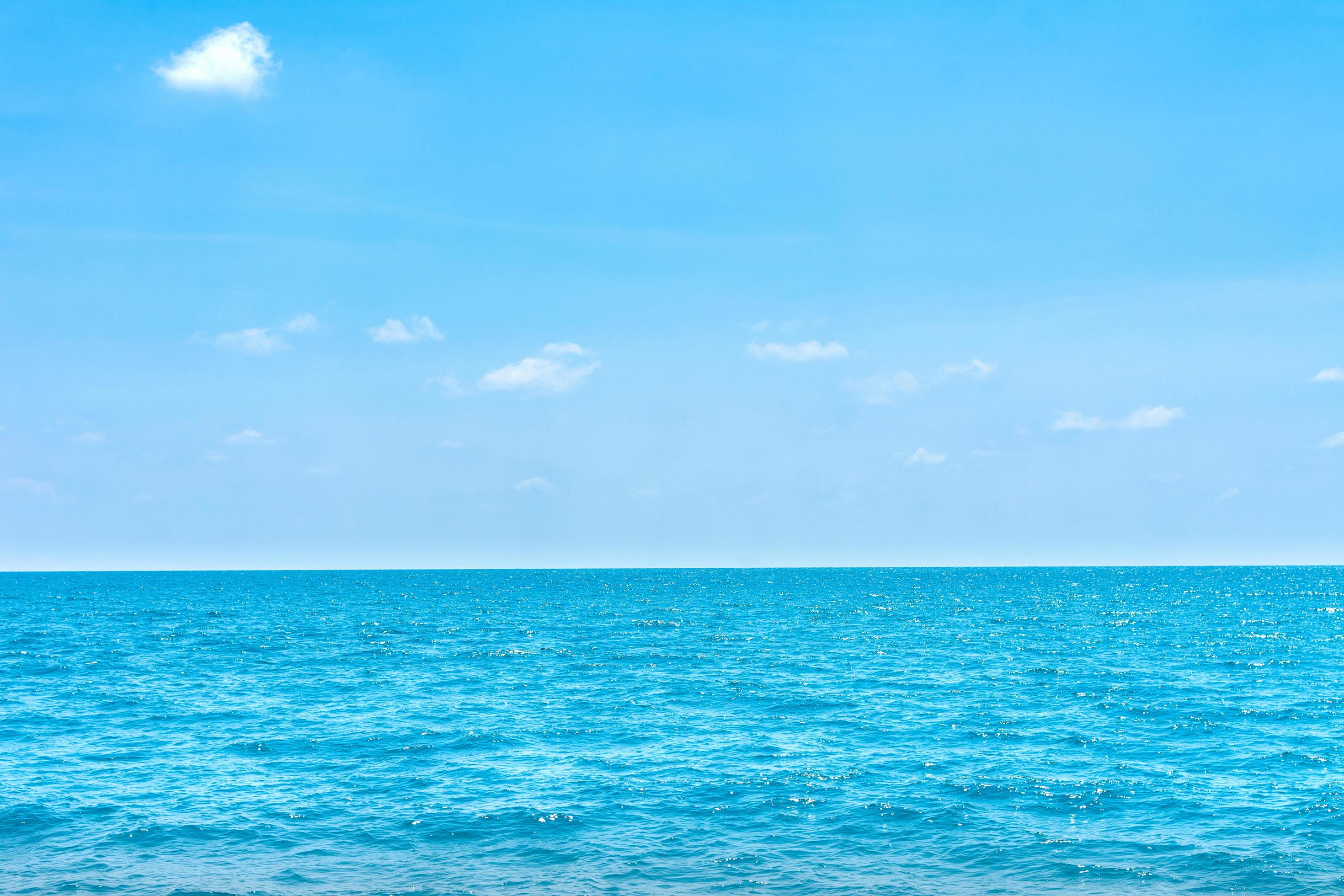 Natural tropical sea surface summer with blue sky background. Stock Free