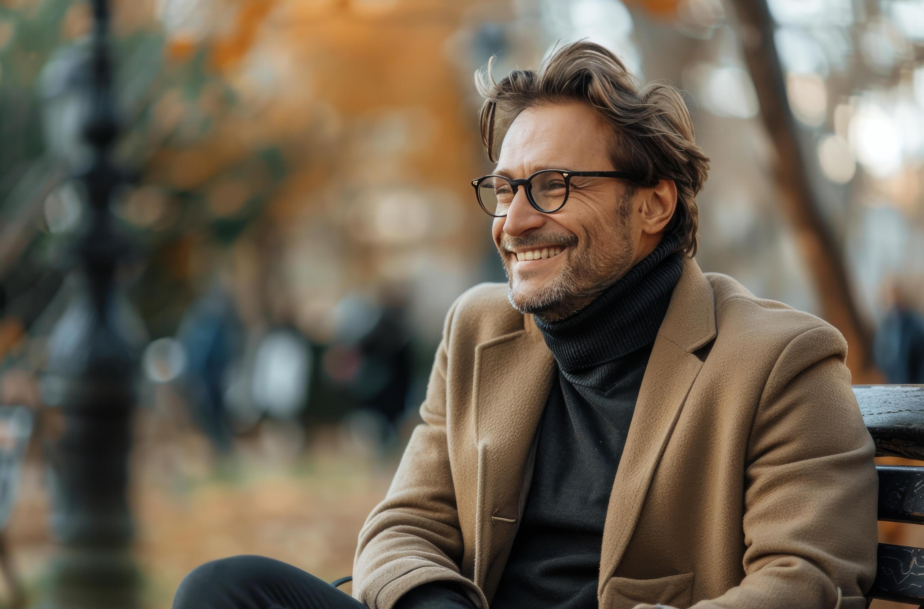 Smiling Man In Brown Coat Sitting On A Bench On An Autumn Day Stock Free