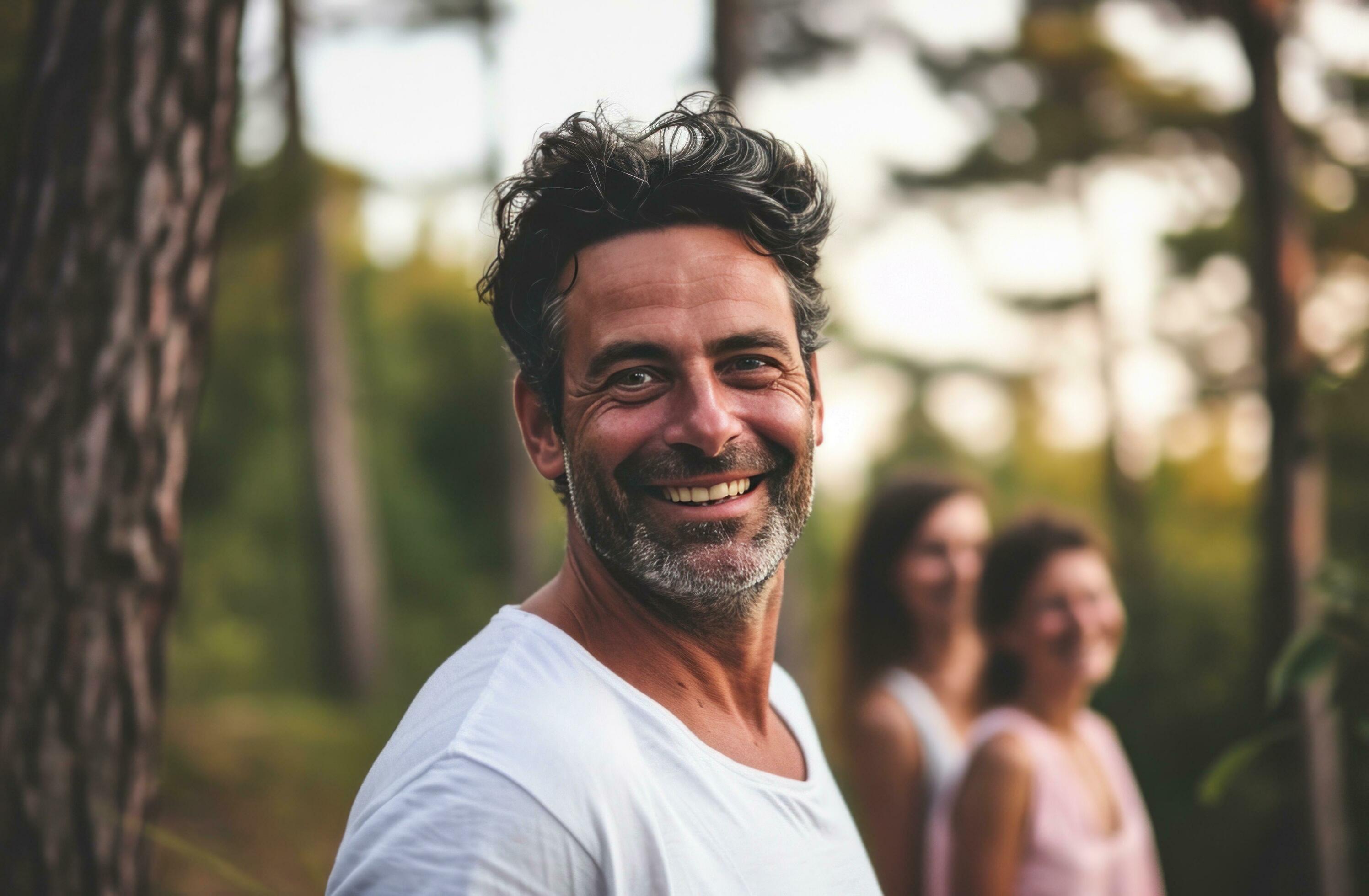 AI generated man in white shirt smiling in outdoors with family Stock Free