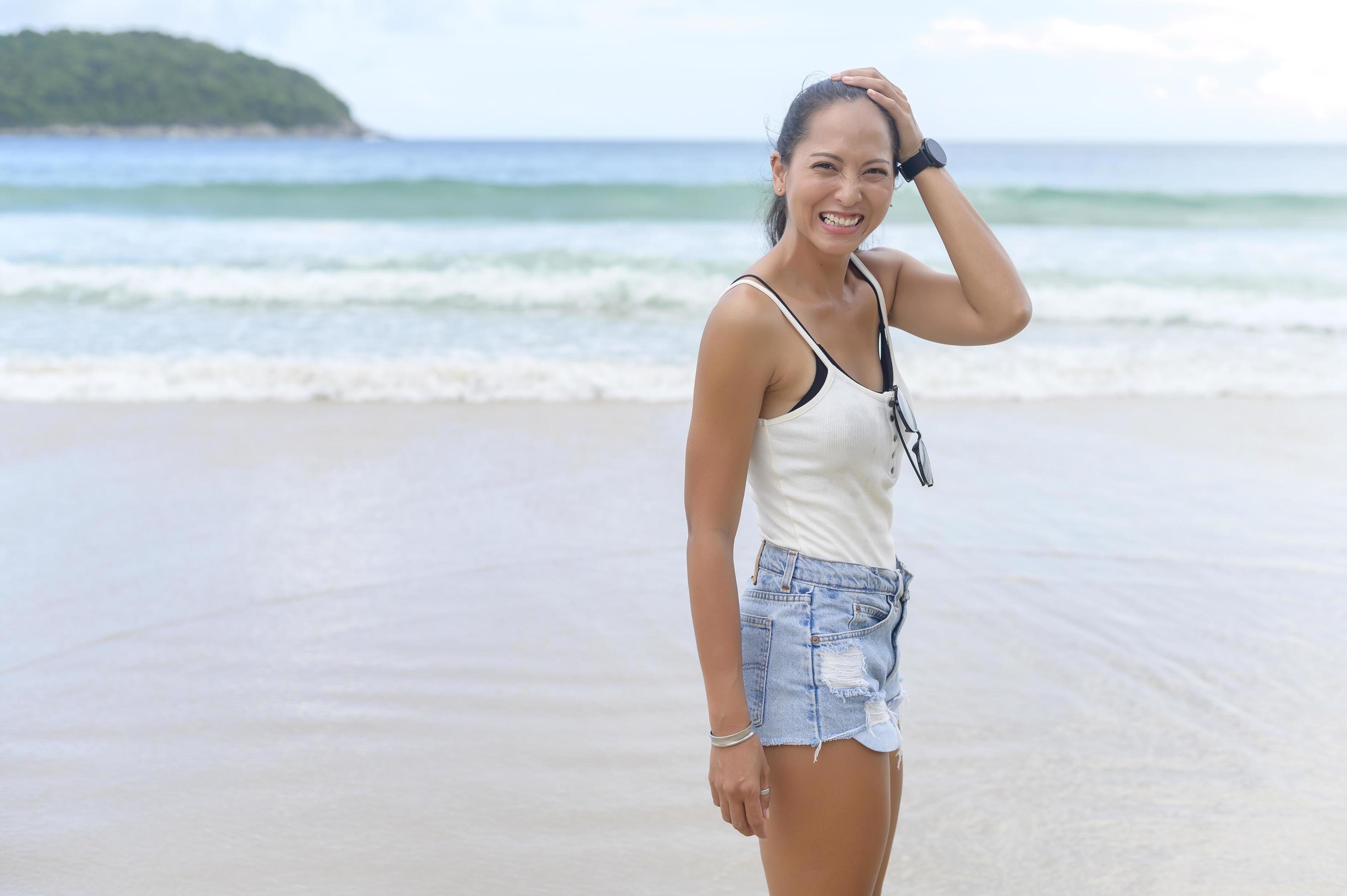 Young Beautiful woman enjoying and relaxing on the beach, Summer, vacation, holidays, Lifestyles concept. Stock Free