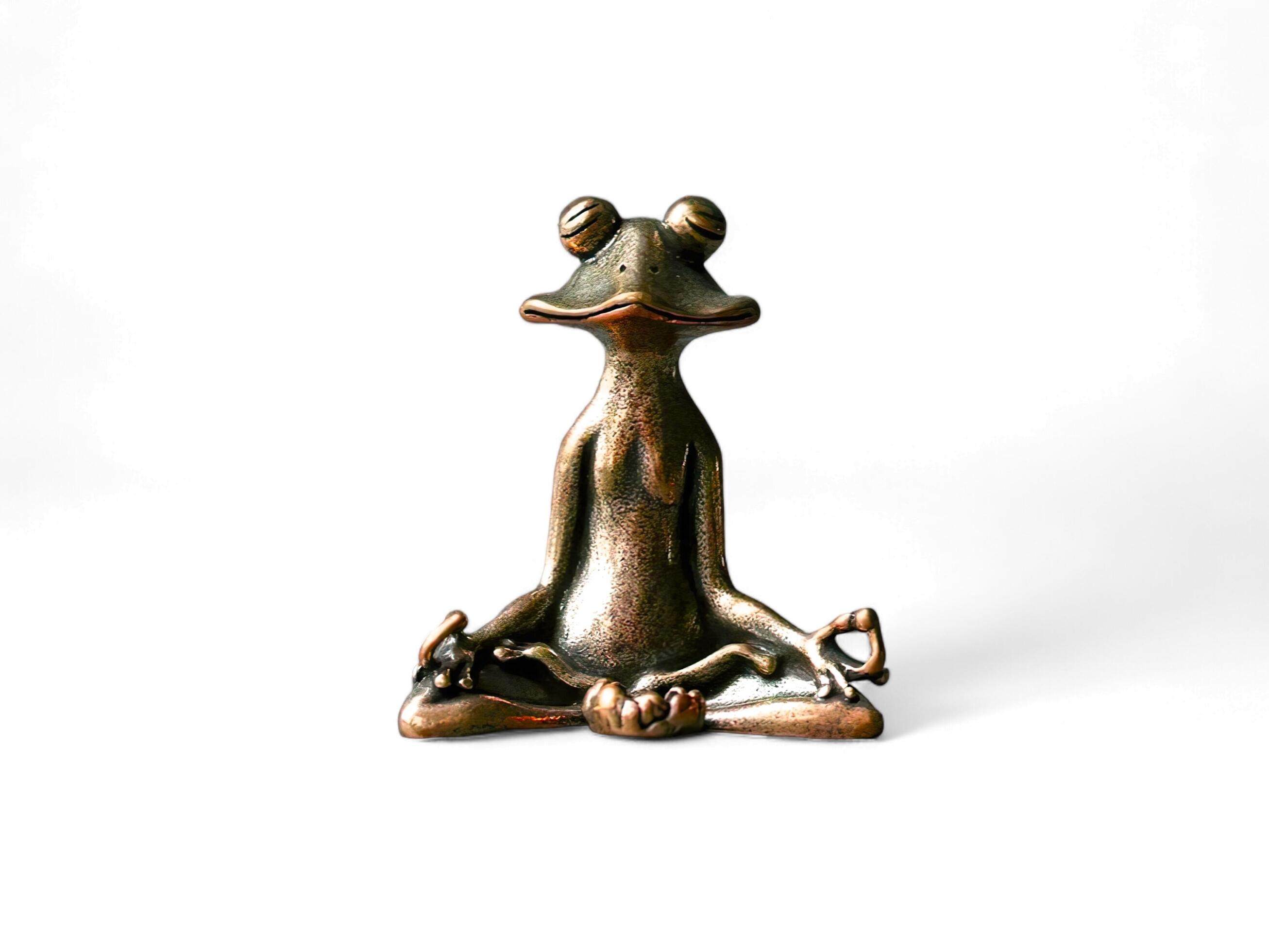 figurine of a frog meditating isolated on white Stock Free