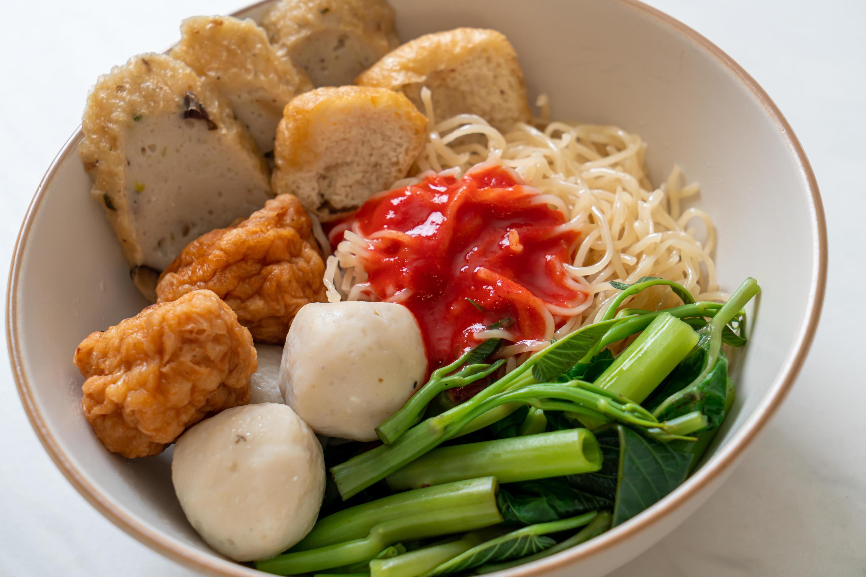 Egg noodles with fish balls and shrimp balls in pink sauce, Yen Ta Four or Yen Ta Fo – Asian food style Stock Free