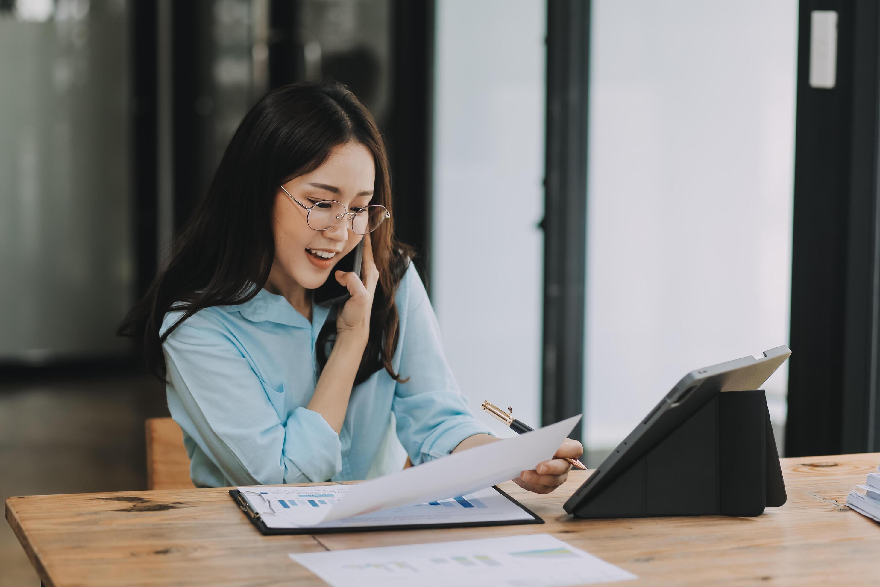 Asian woman working at the office. woman using laptop computer on desk at office Stock Free