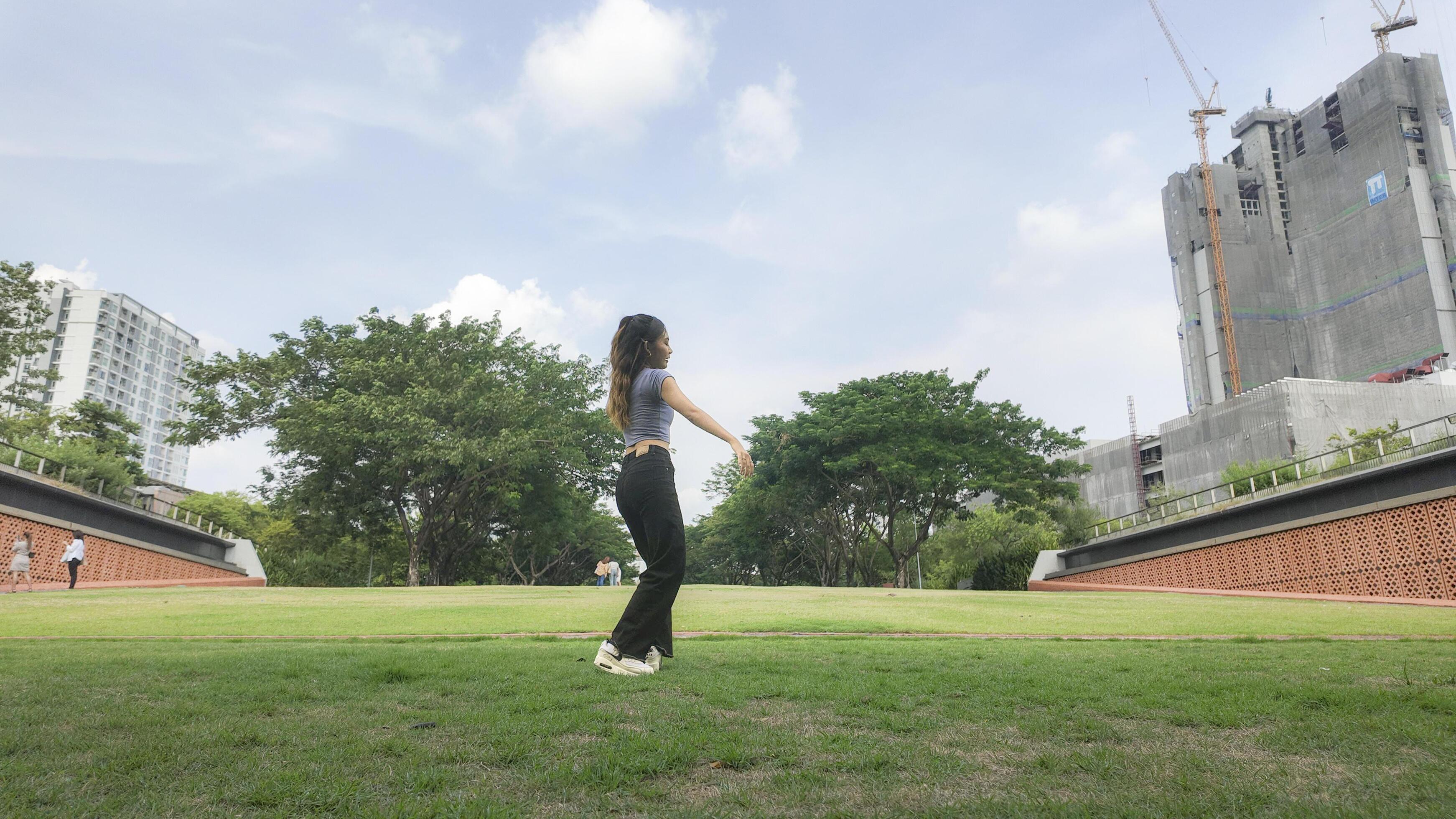 Asian women do freestyle hip hop and breakdancing in a public space in the middle of the city. With a cheerful and happy attitude Stock Free