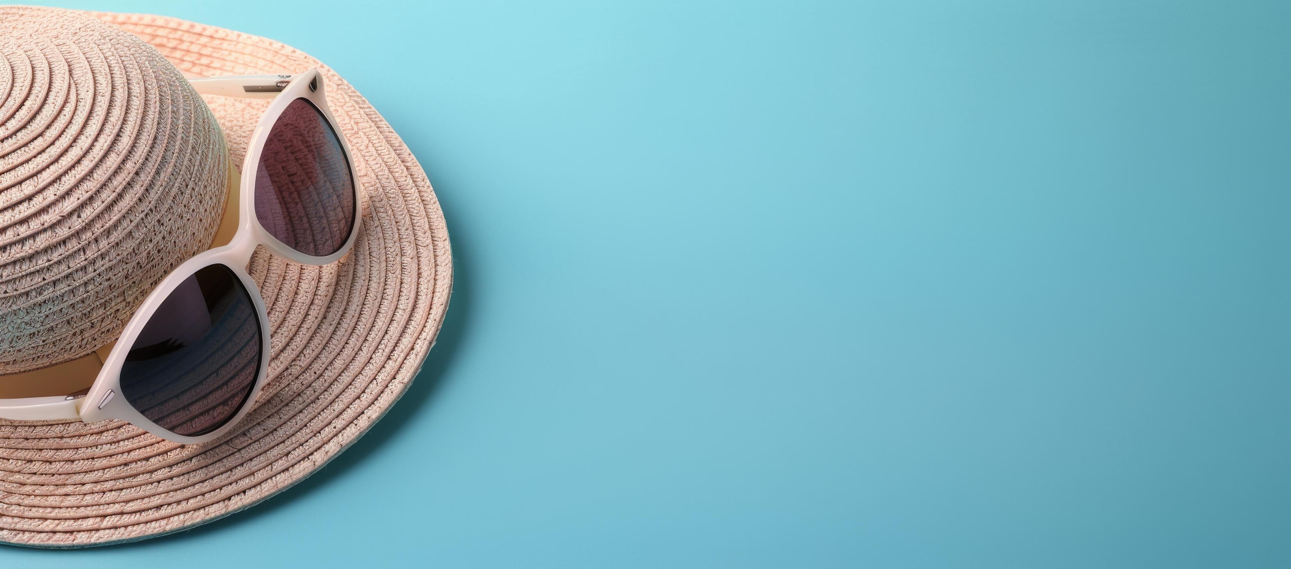 Summer Hat and Sunglasses on Light Blue Background Stock Free