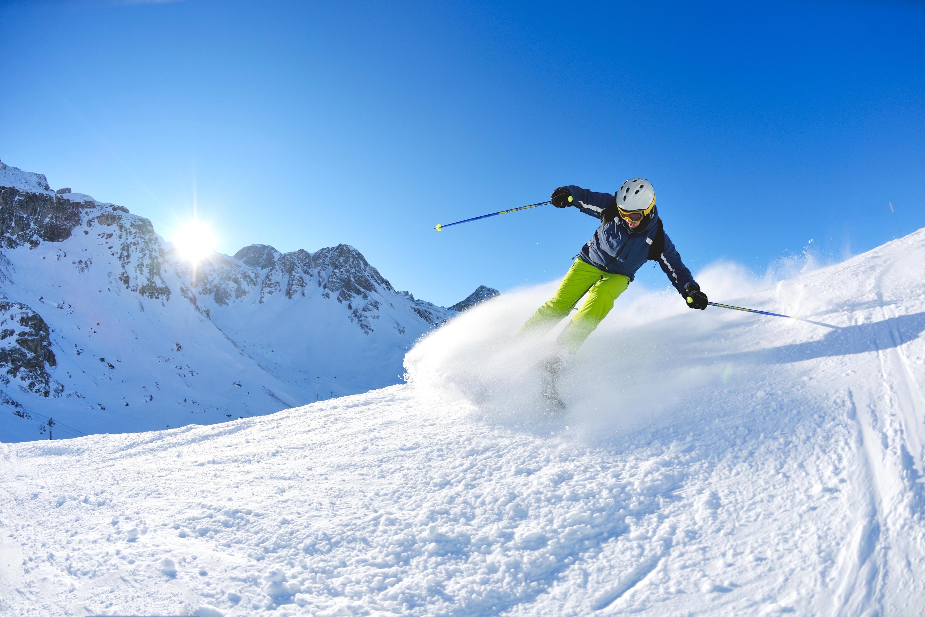 skiing on fresh snow at winter season at beautiful sunny day Stock Free