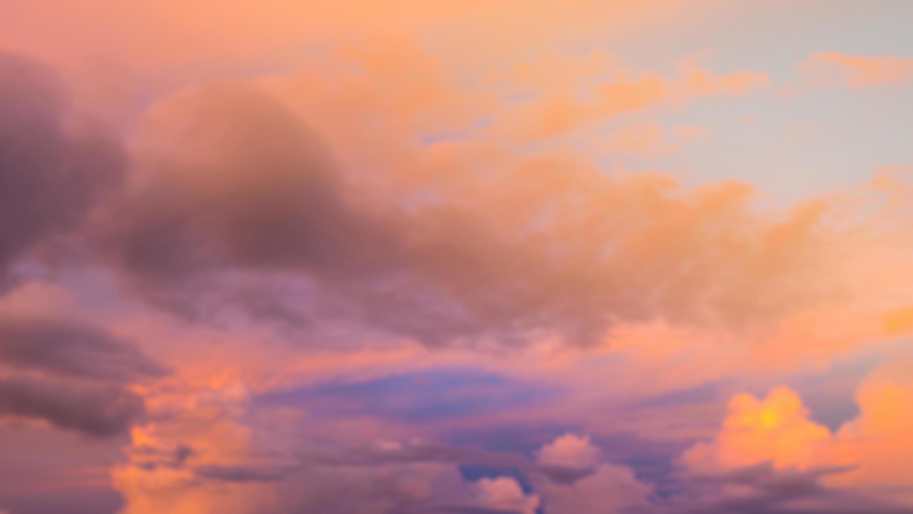 Dramatic sunset sky with clouds. Blur or defocus image. Stock Free