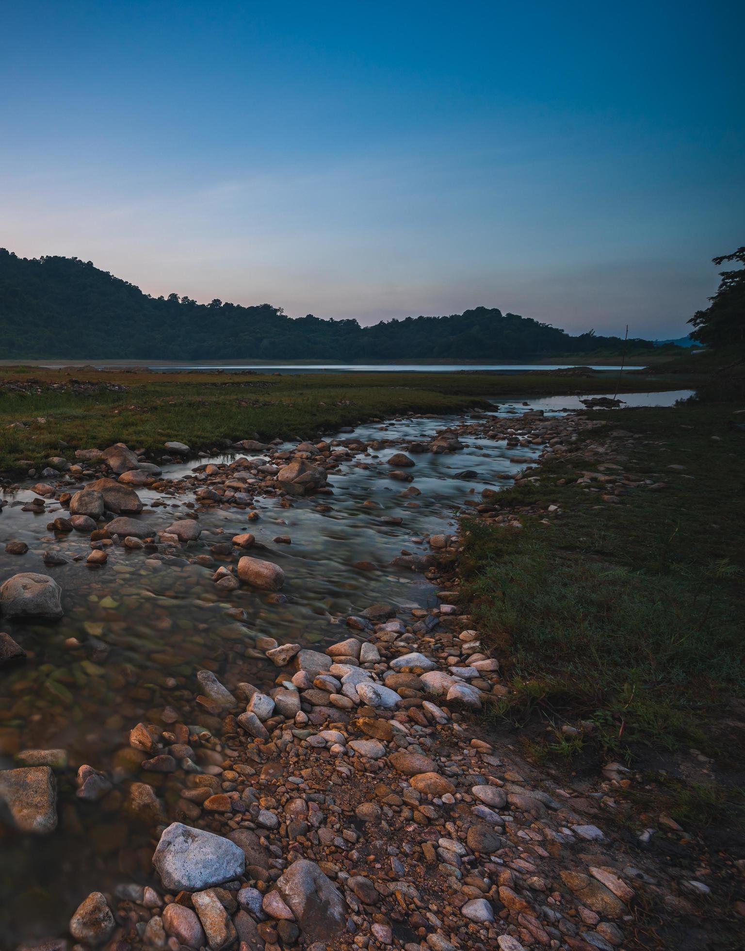 Nature landscape view of fresh water stream Stock Free