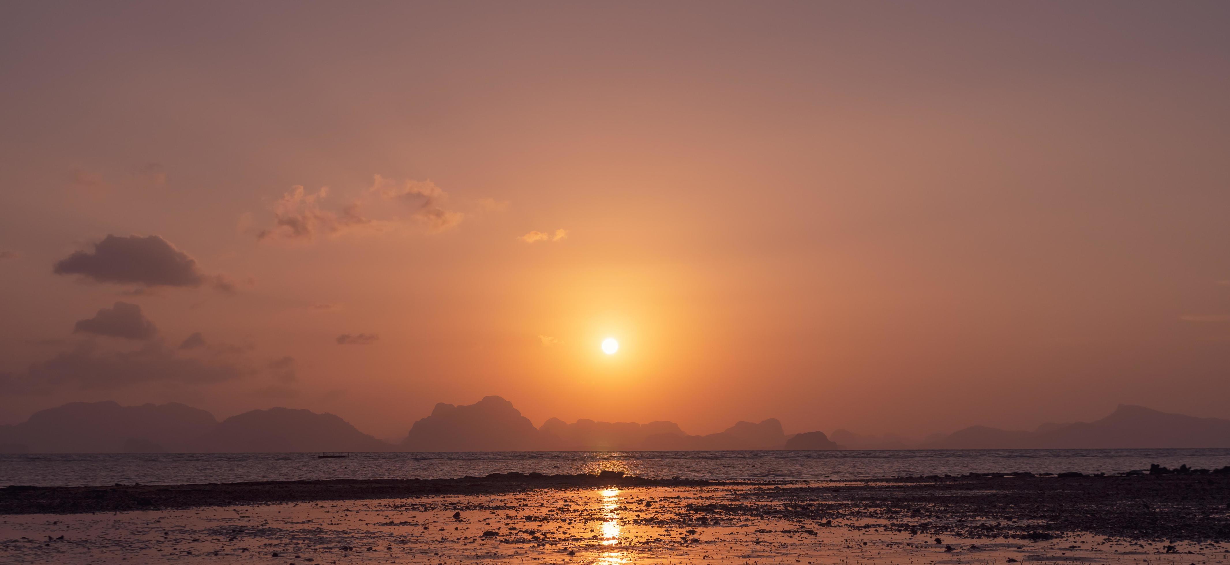 Tropical nature clean beach sunset sky time with sunlight background. Stock Free